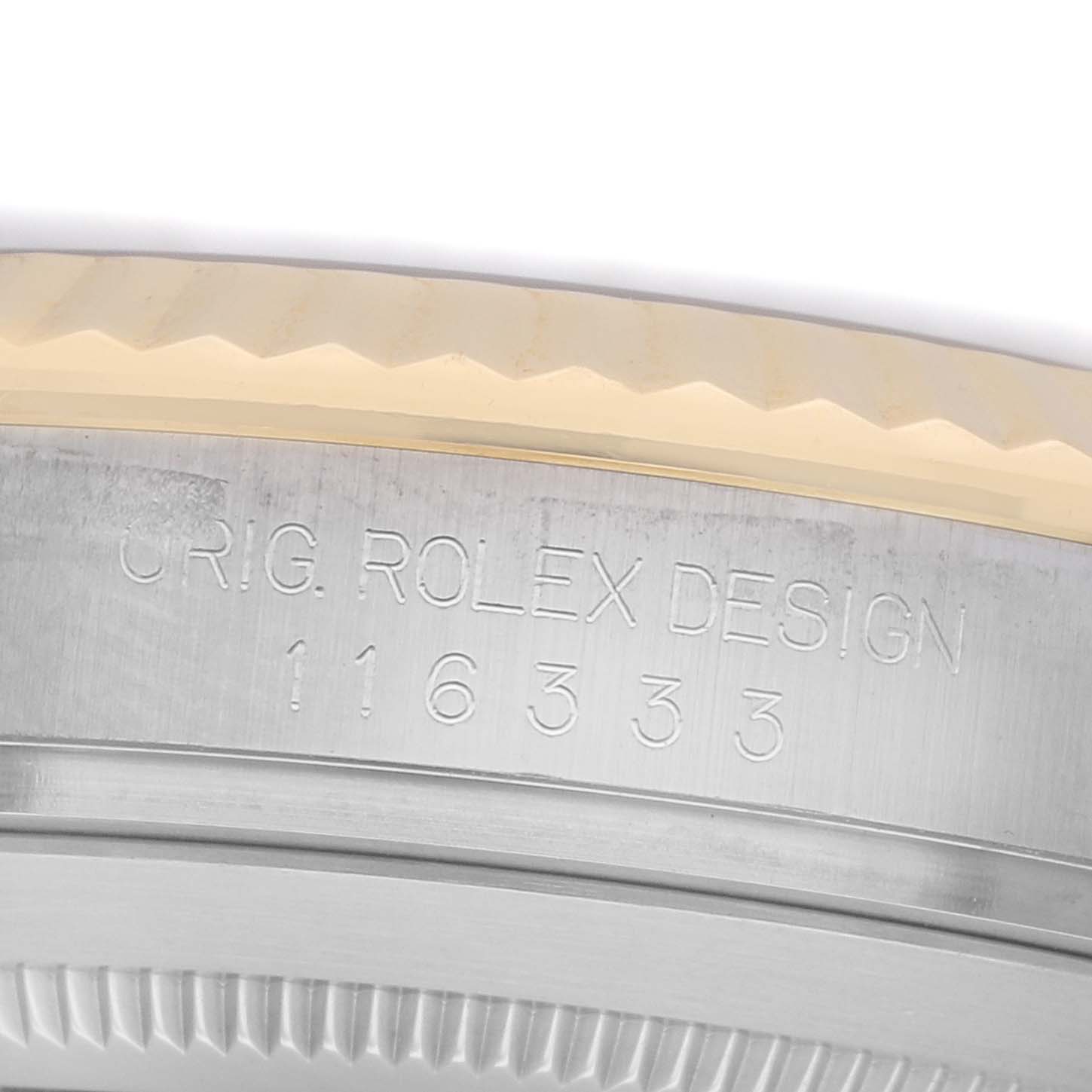 The image shows a close-up of the side of a Rolex Datejust 41 116333 Men's Steel and Gold (two tone) Black Dial watch, highlighting the bezel and engraved model number.