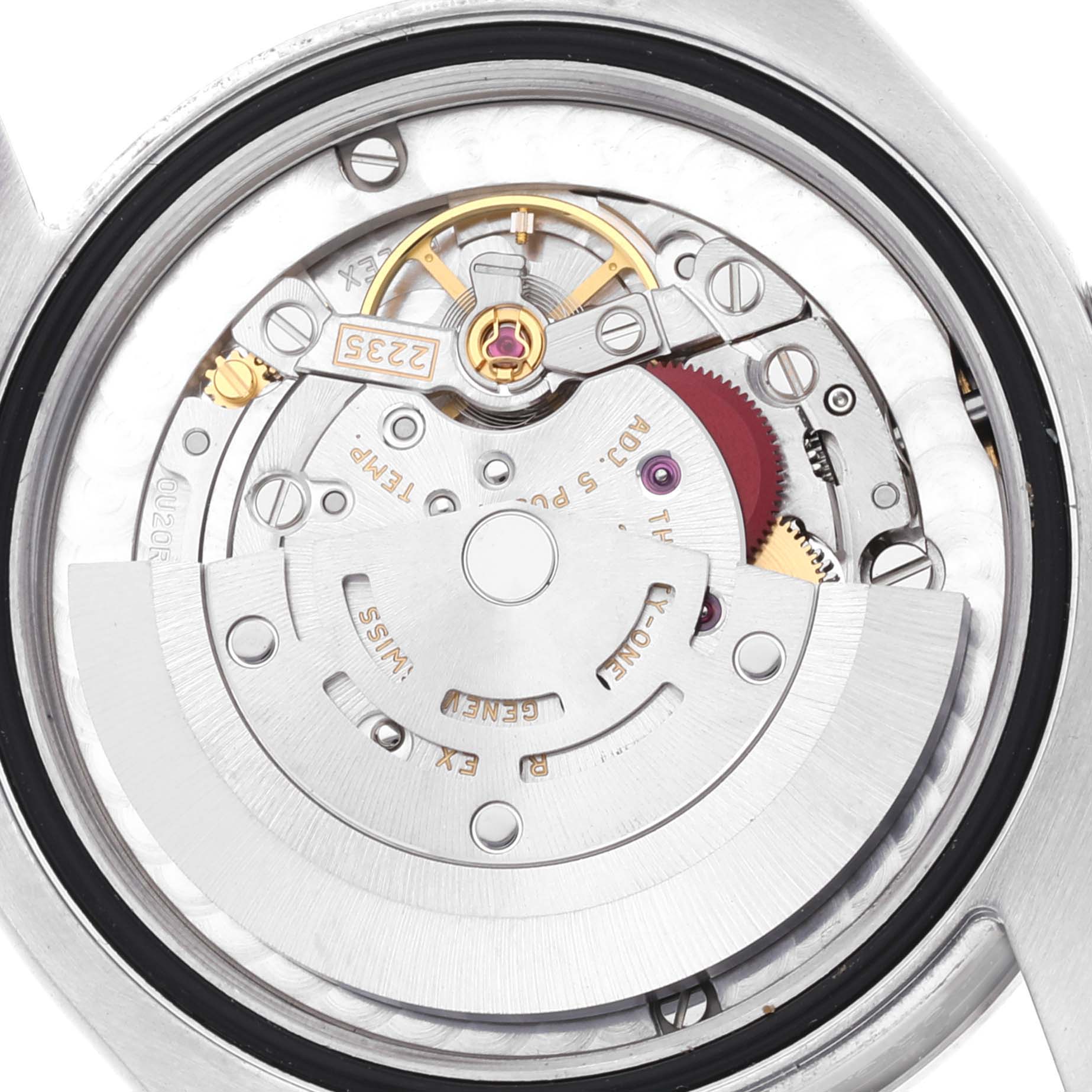 This image shows the intricate movement and internal mechanics of a mid-size Rolex watch viewed from the back.