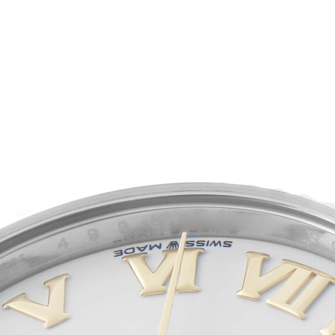 The image shows a close-up of the dial
s top edge, part of the bezel, and Roman numerals of the Rolex Datejust 278273 Women
s Steel and Gold (two tone) White Dial watch.
