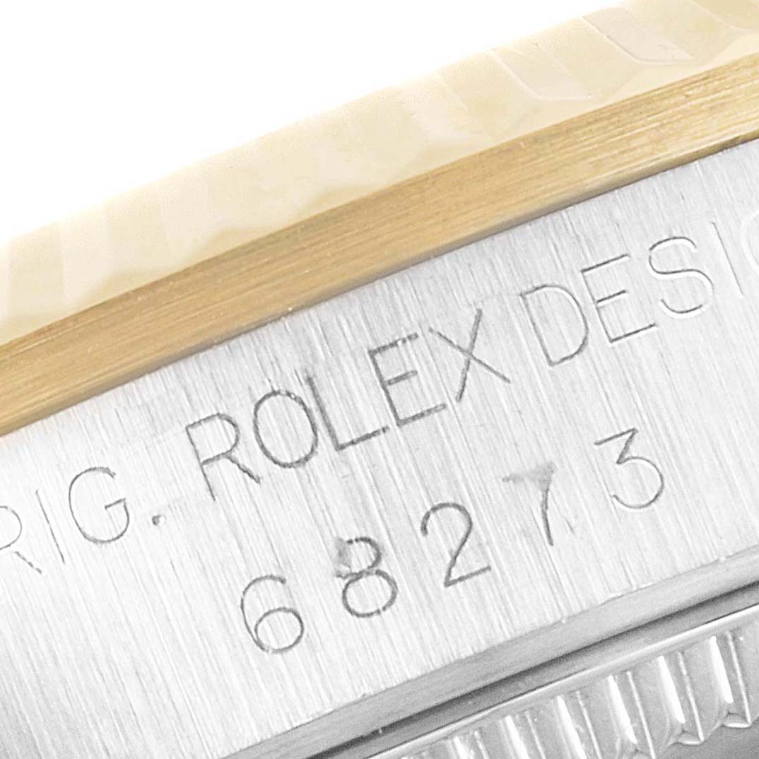 This is a close-up angle showing the model number and part of the bezel of a Rolex Mid-Size 68273 Women's Steel and Gold (two tone) Champagne Dial 68273 Women's Steel and Gold (two tone) Champagne Dial watch.