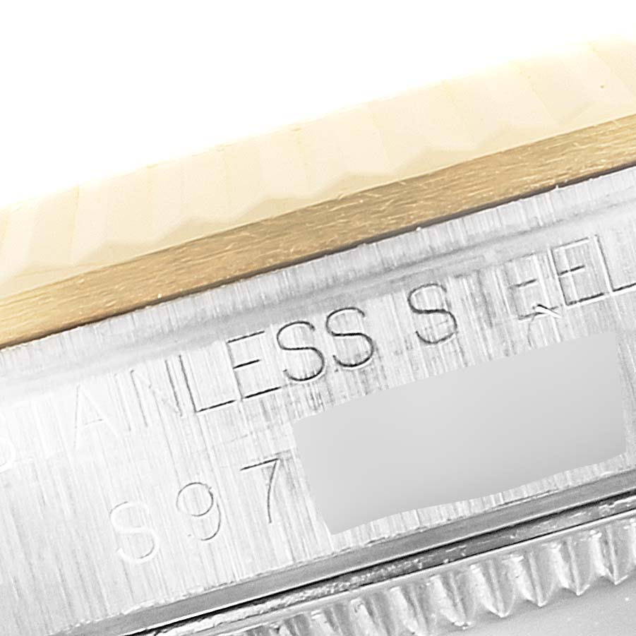 The image shows a close-up view of the stainless steel case and partially visible bezel of a Rolex Mid-Size 68273 Women's Steel and Gold (two tone) Champagne Dial 68273 Women's Steel and Gold (two tone) Champagne Dial model watch.