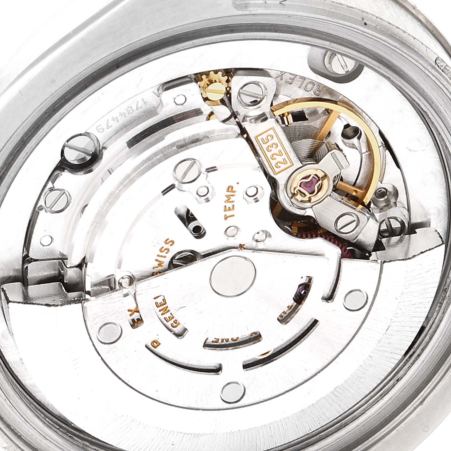The image shows the intricate internal mechanism of the Rolex Mid-Size 178274 Women
s Stainless Steel Mother of Pearl Dial 178274 Women
s Stainless Steel Mother of Pearl Dial watch, focusing on the movement and gears.