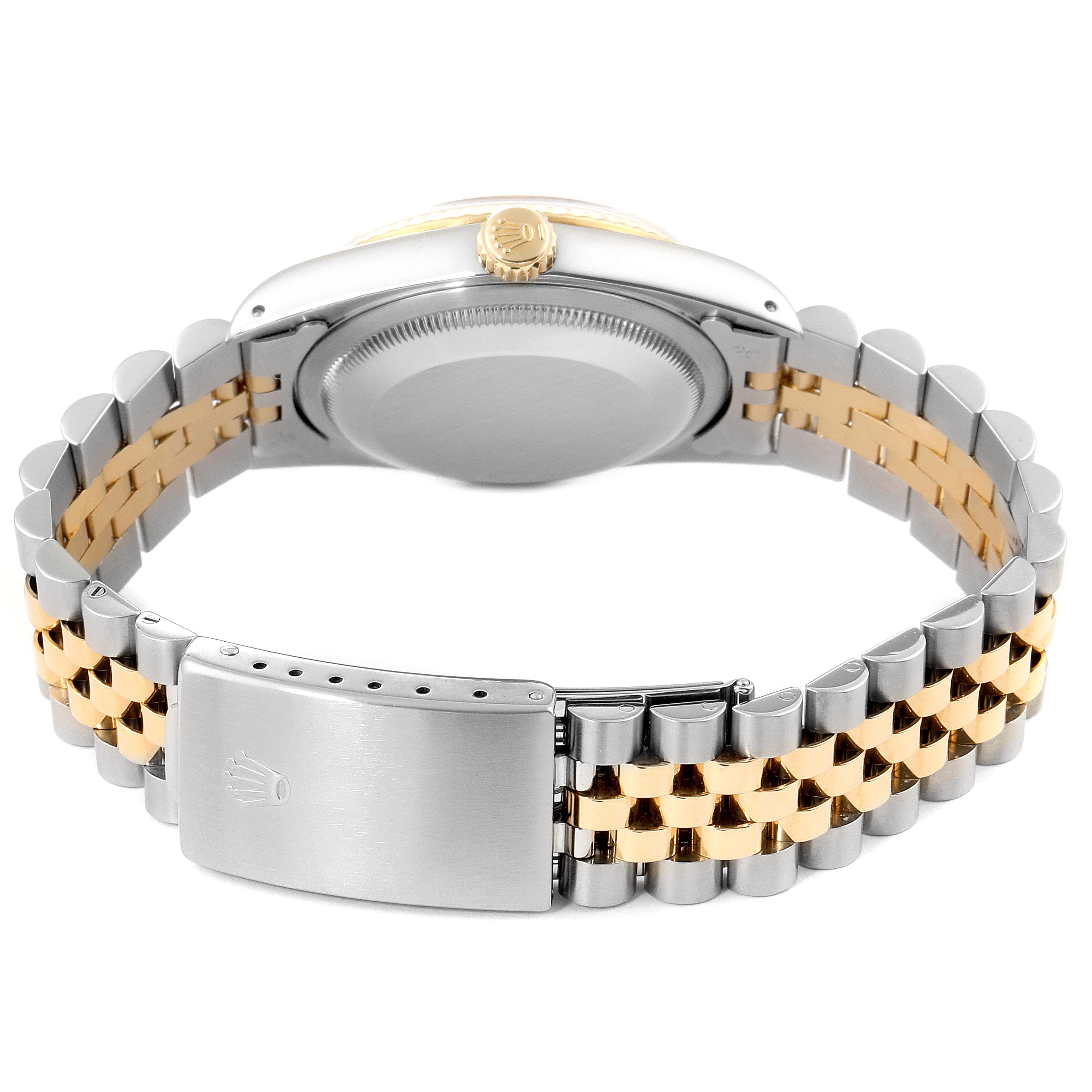 The image shows the back and clasp of a Rolex Datejust 16233 Men's Steel and Gold (two tone) Champagne Dial 16233 Men's Steel and Gold (two tone) Champagne Dial watch, highlighting its two-tone metal bracelet.