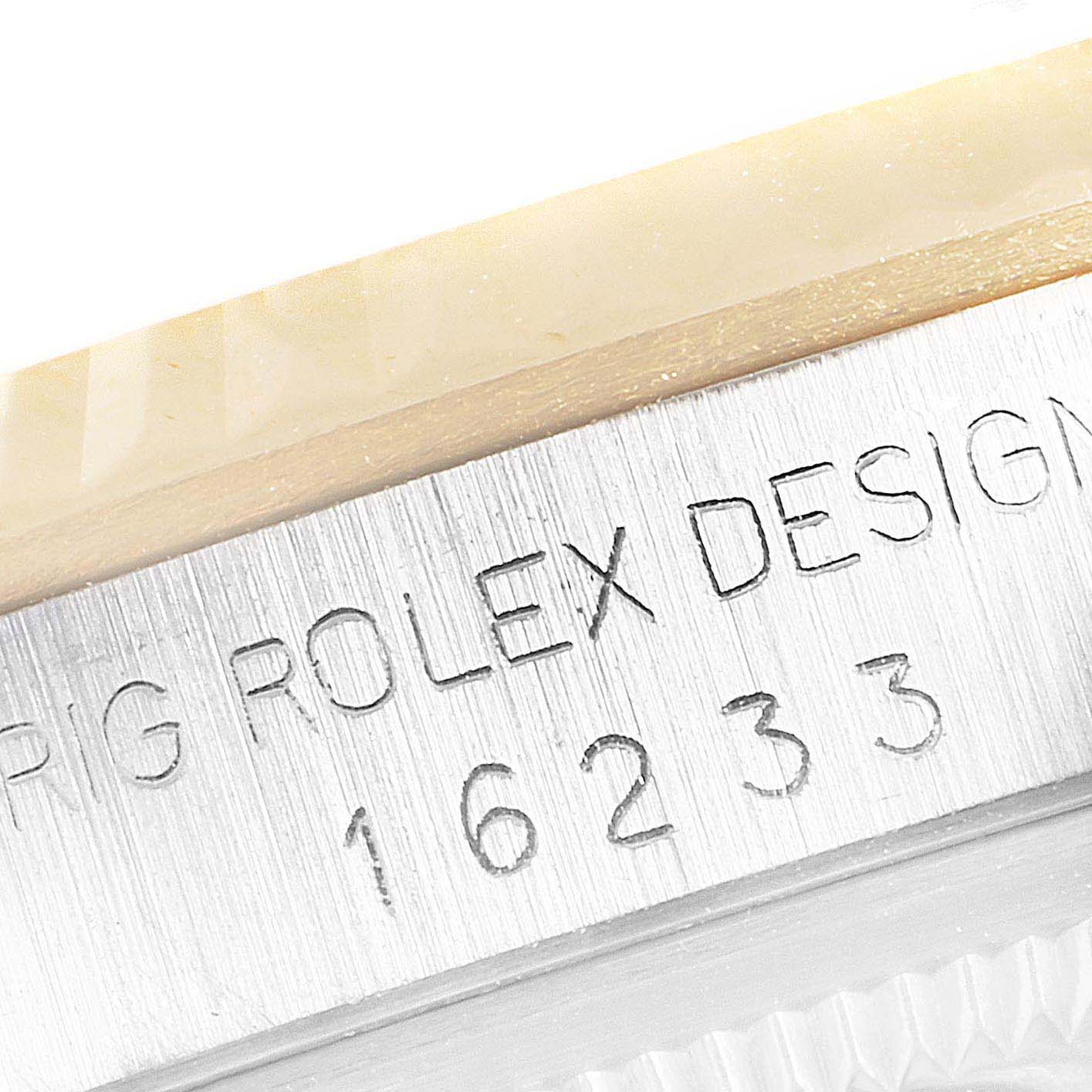 This close-up image shows the engraved serial and model number on the case of a Rolex Datejust 16233 Men's Steel and Gold (two tone) Champagne Dial 16233 Men's Steel and Gold (two tone) Champagne Dial watch.