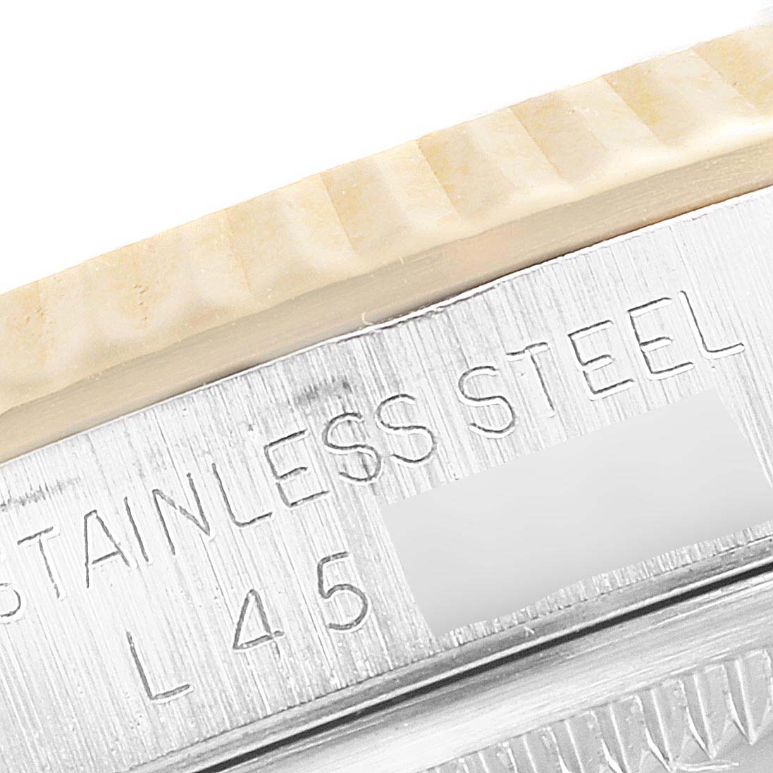 The image shows a close-up of the side of a Rolex Datejust 16233 Men's Steel and Gold (two tone) Champagne Dial 16233 Men's Steel and Gold (two tone) Champagne Dial model watch, highlighting the "Stainless Steel" engraving.