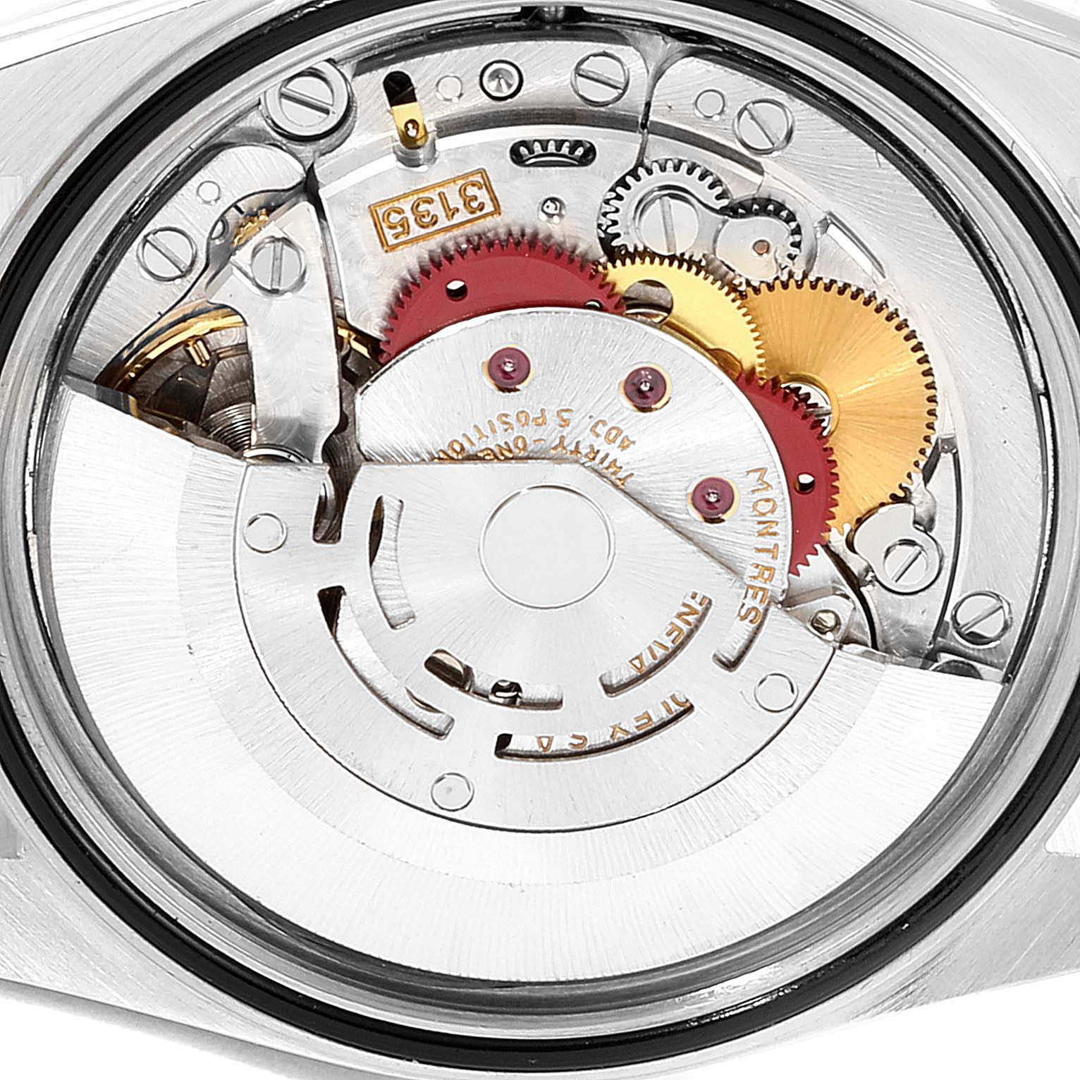 The image shows the internal mechanism of a Rolex Datejust 16233 Men's Steel and Gold (two tone) Champagne Dial 16233 Men's Steel and Gold (two tone) Champagne Dial watch, including gears and movement parts, taken from the back.