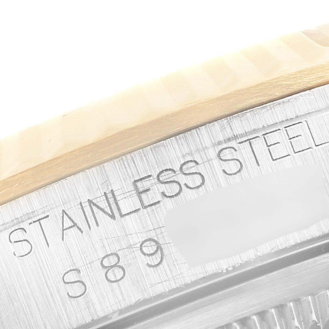 The image shows a close-up of the case back engraving of a Rolex Datejust 16233 Men's Steel and Gold (two tone) Champagne Dial 16233 Men's Steel and Gold (two tone) Champagne Dial watch, highlighting "Stainless Steel" and a partial serial number.