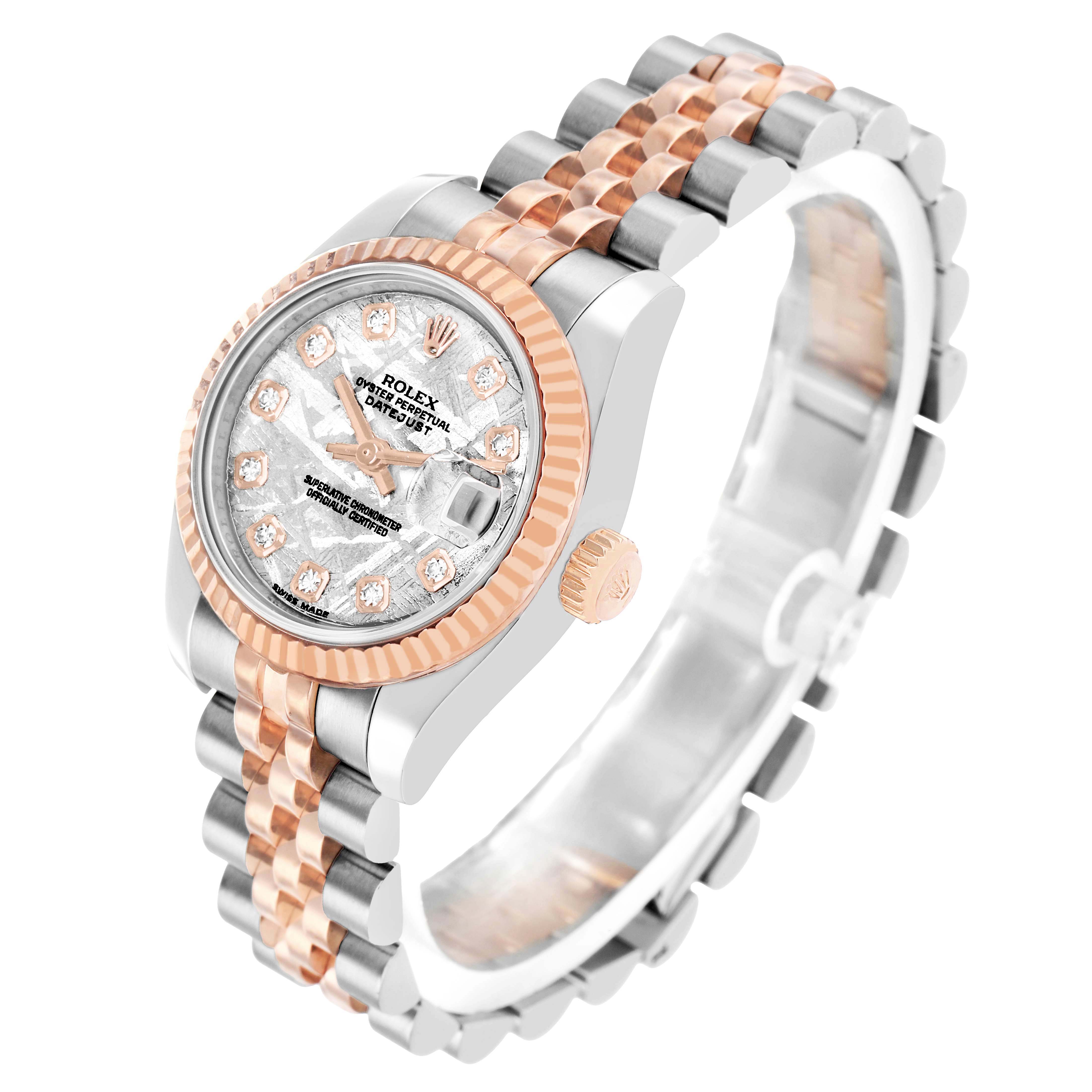 The Rolex Datejust 179171 Women's Steel and Gold (two tone) Silver Dial watch is shown at an angled view, highlighting the face, fluted bezel, crown, and two-tone bracelet.