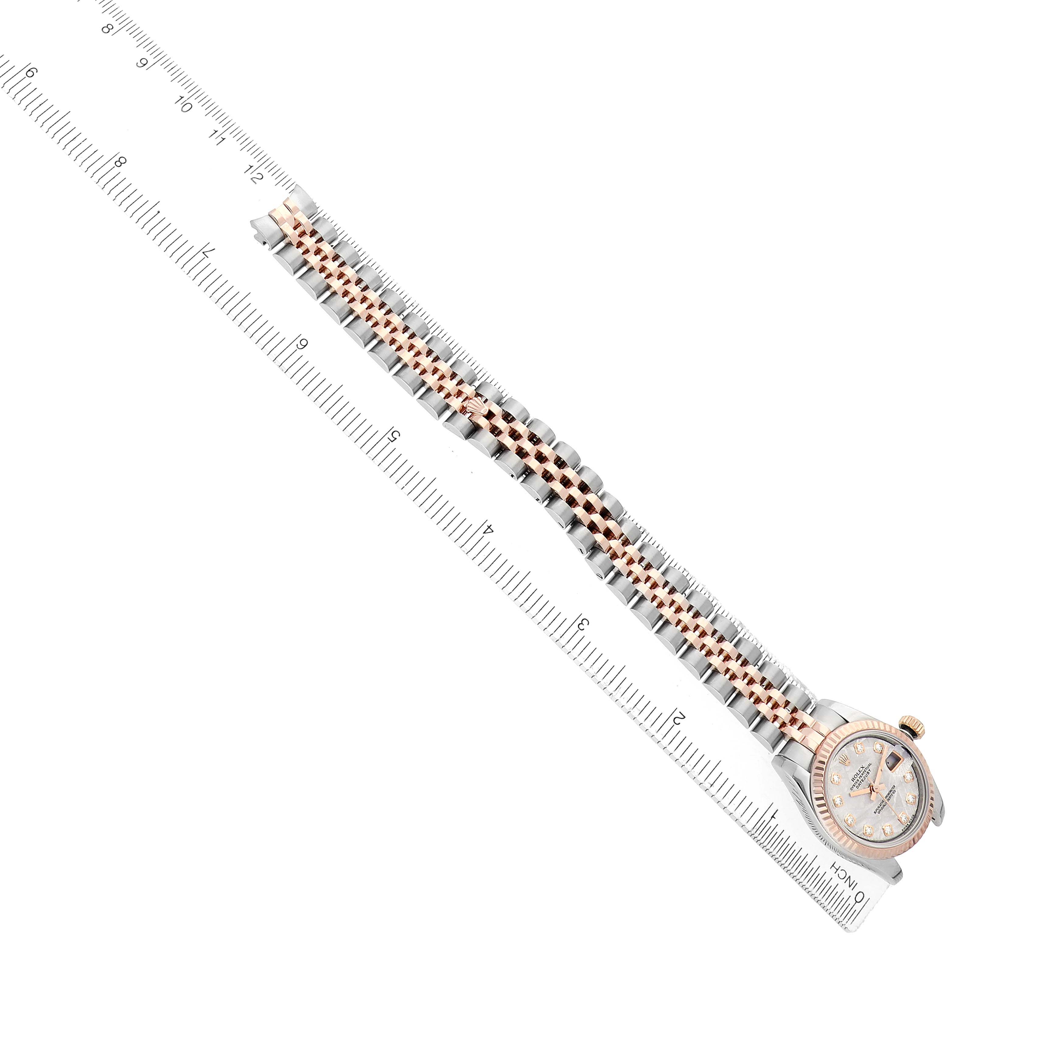 The Rolex Datejust 179171 Women's Steel and Gold (two tone) Silver Dial watch is shown from an overhead angle, including its full bracelet and the face partially visible at the end.