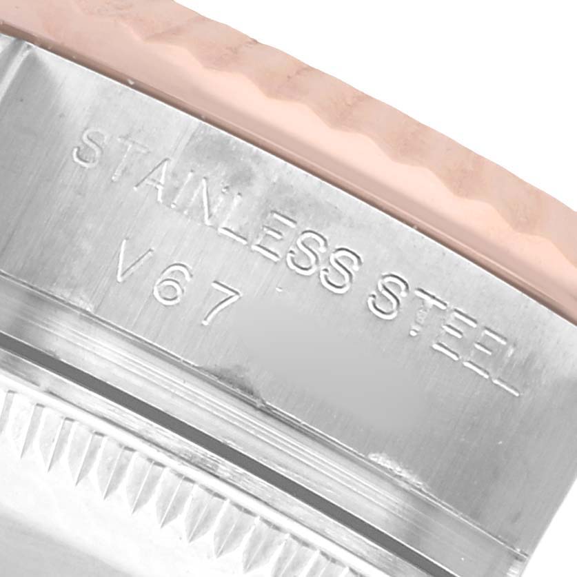 The image shows a close-up of the case side of a Rolex Datejust 179171 Women's Steel and Gold (two tone) Silver Dial, highlighting the "STAINLESS STEEL" engraving.