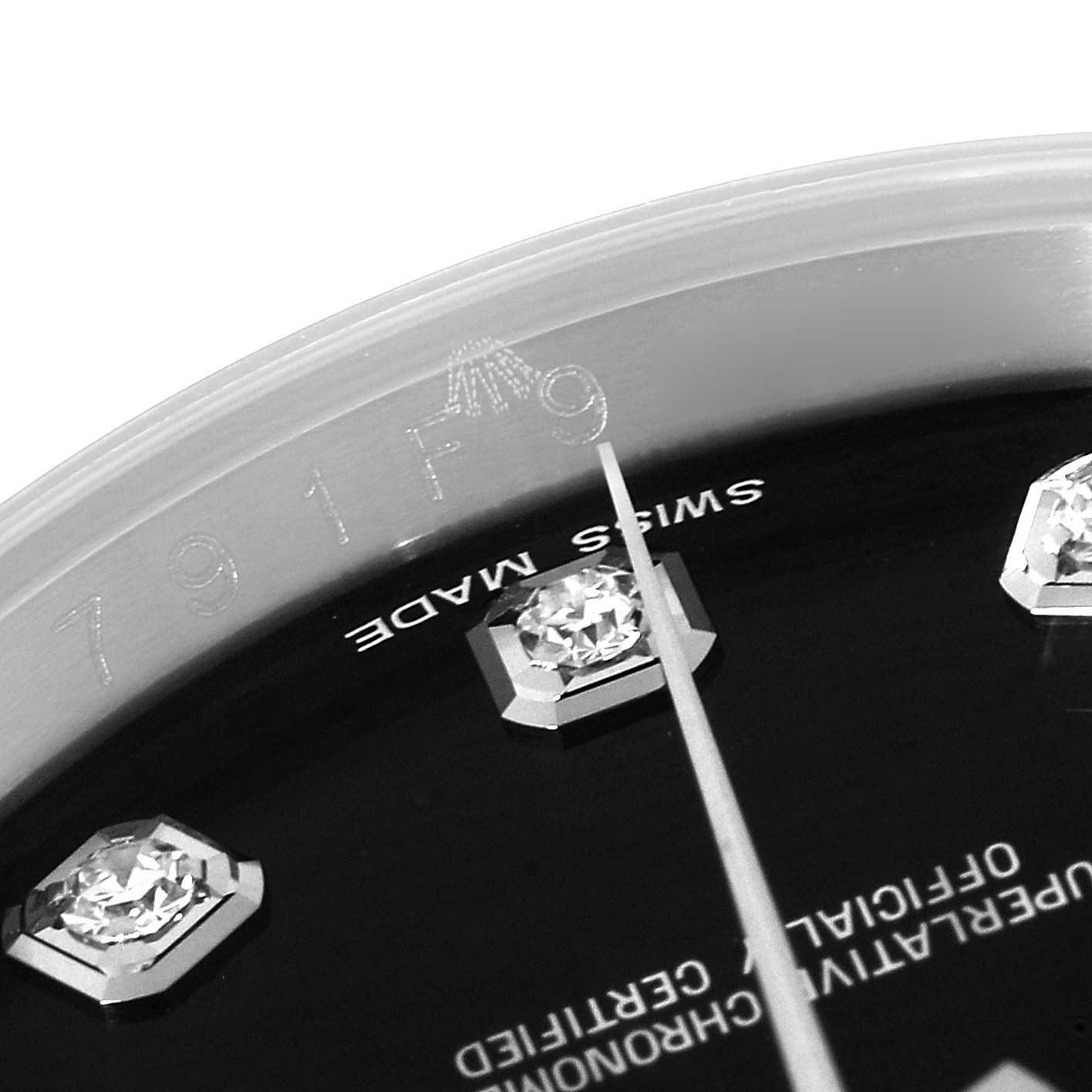 This close-up angle of a Rolex Datejust 116234 Men's Stainless Steel Black Dial 116234 Men's Stainless Steel Black Dial watch shows part of the dial, diamond markers, and the "Swiss Made" text.