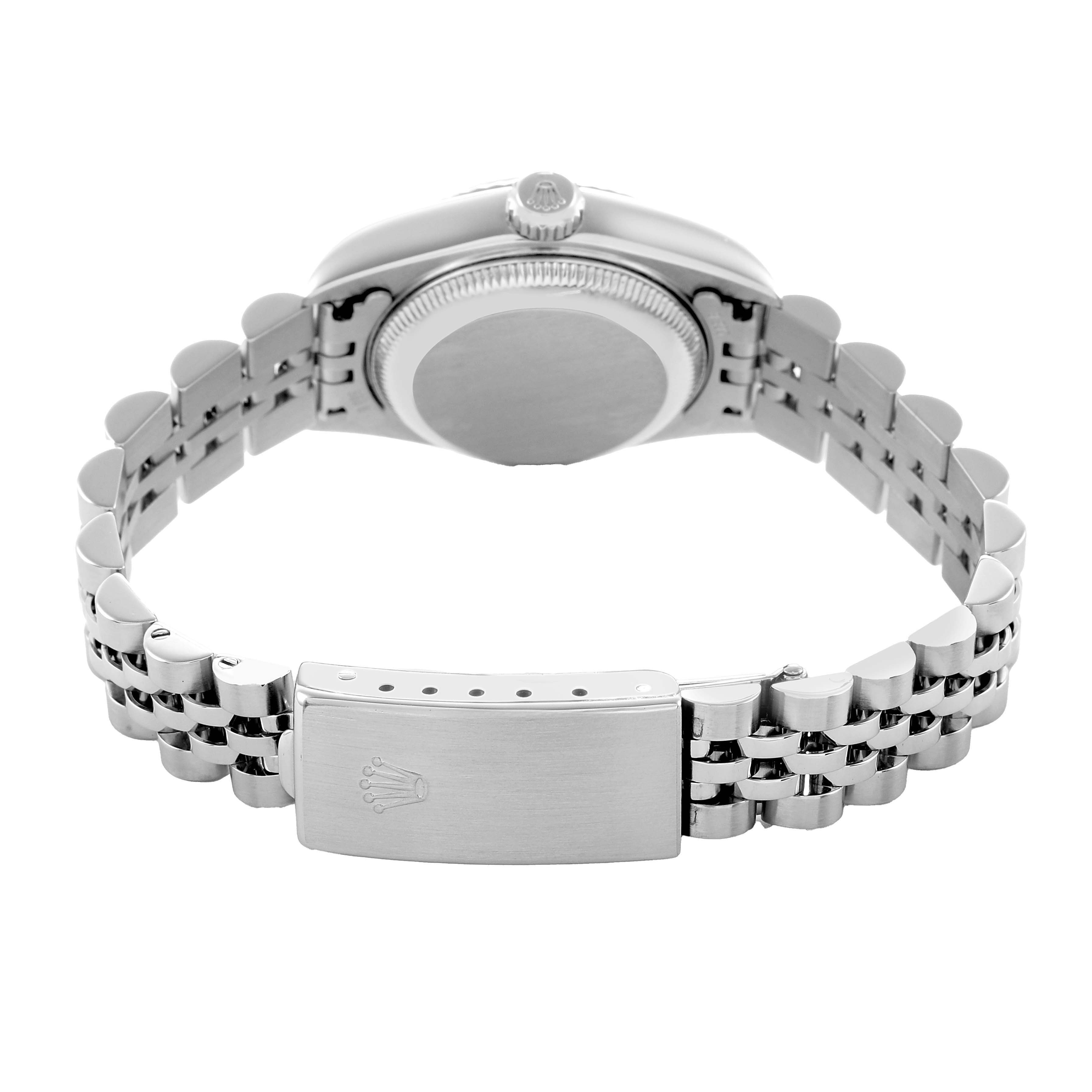 The Rolex Datejust 79174 Women's Stainless Steel White Dial watch is shown from the back, displaying the case back, crown, and bracelet clasp.