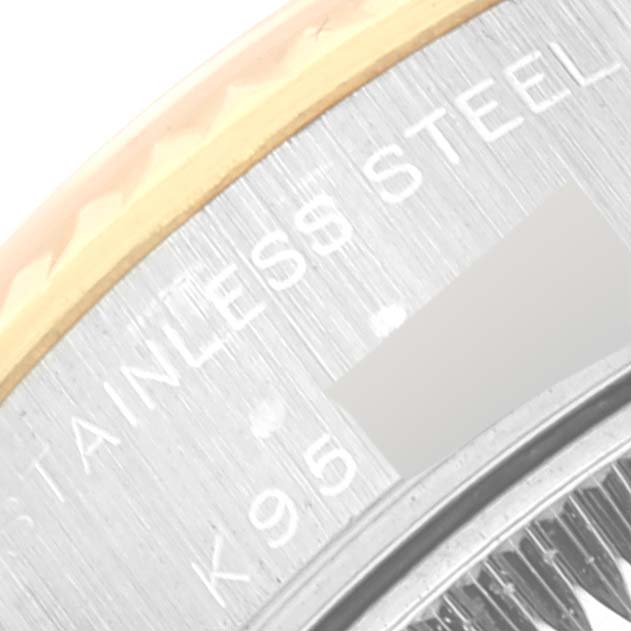 This close-up image shows part of the stainless steel and gold bezel of a Rolex Datejust 79173 Women's Steel and Gold (two tone) Champagne Dial 79173 Women's Steel and Gold (two tone) Champagne Dial watch.