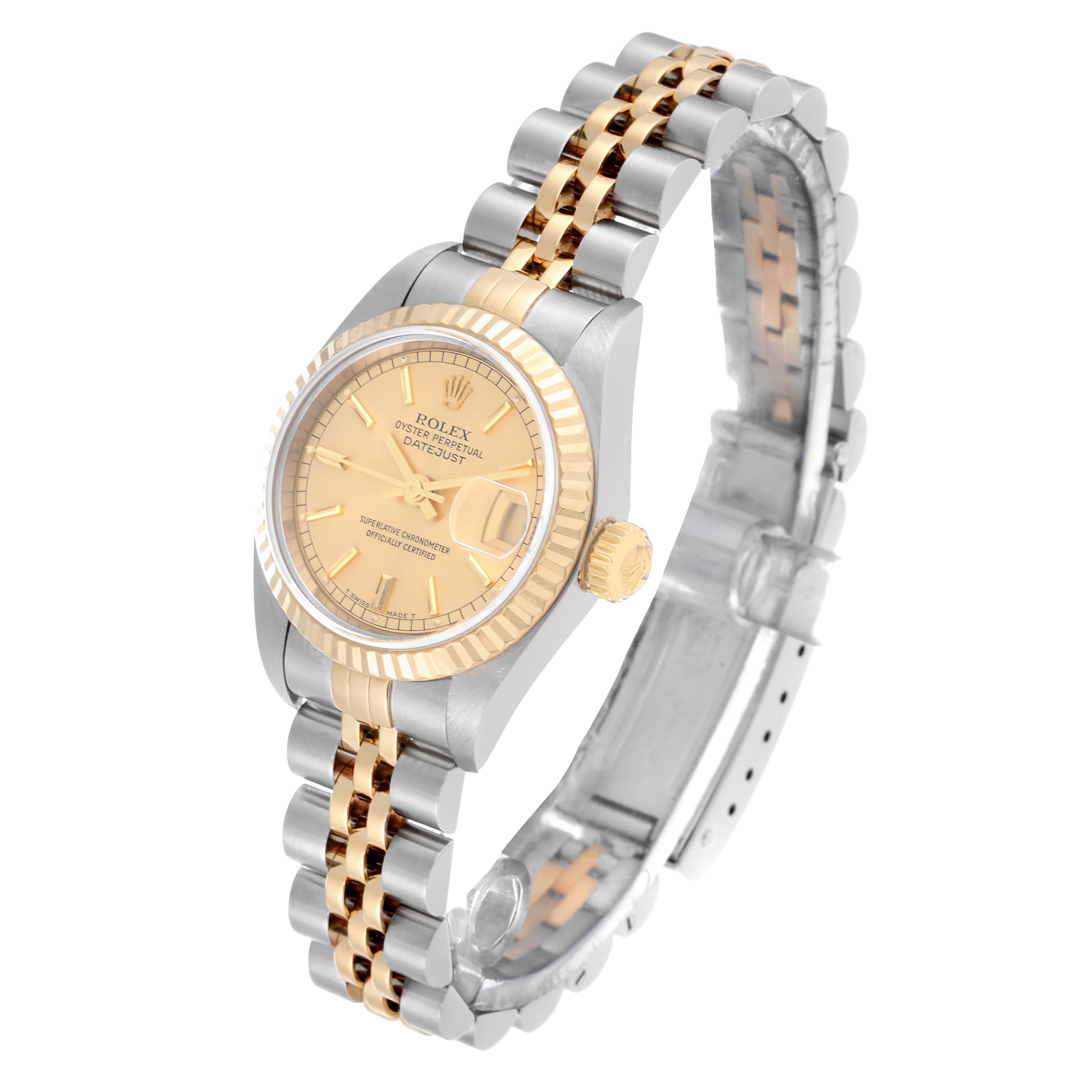 The Rolex Datejust 79173 Women's Steel and Gold (two tone) Champagne Dial 79173 Women's Steel and Gold (two tone) Champagne Dial watch is shown at a slight angle, highlighting its face, bezel, crown, and two-tone bracelet.