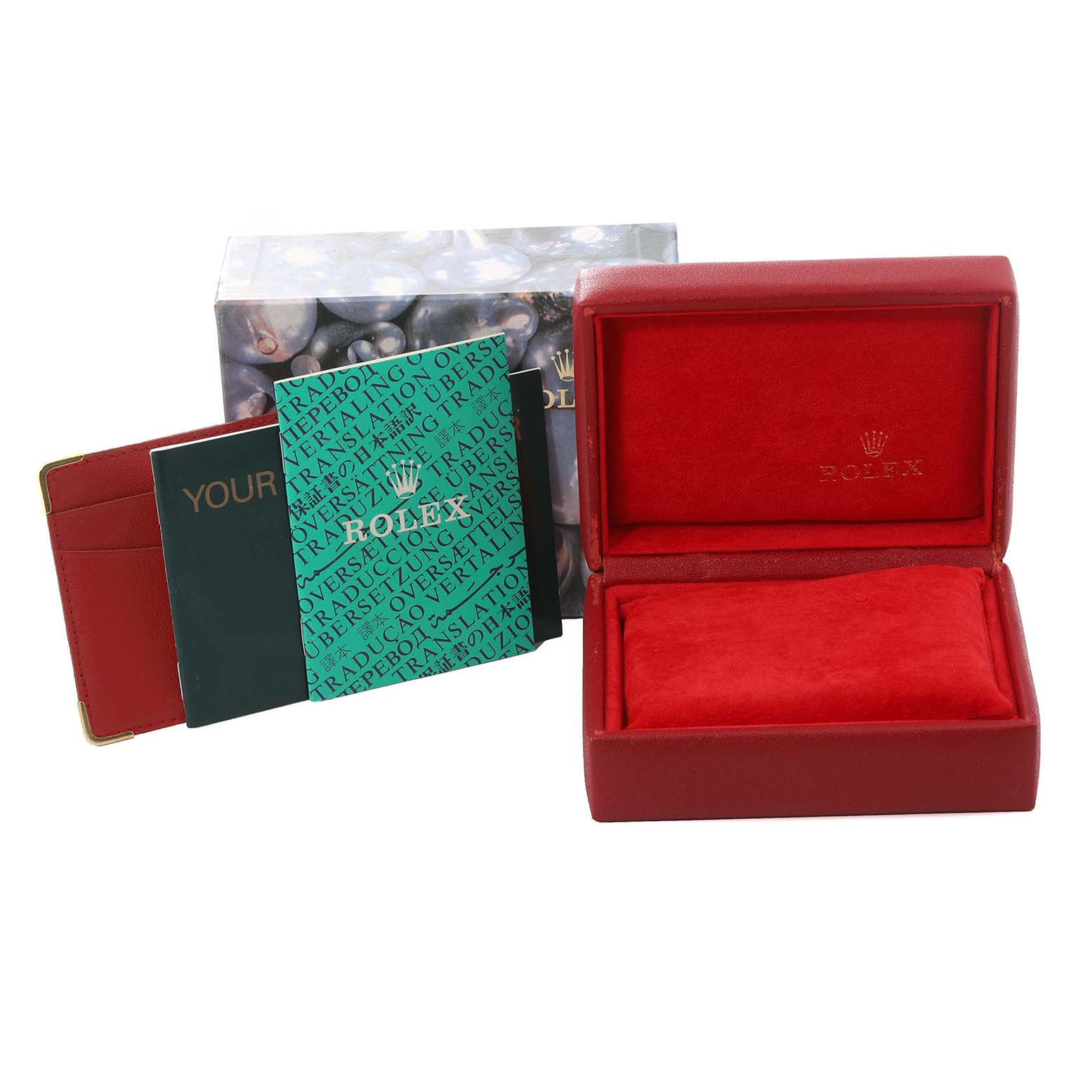 The image shows the packaging and accessories for a Rolex Datejust 79173 Women's Steel and Gold (two tone) Champagne Dial 79173 Women's Steel and Gold (two tone) Champagne Dial, including a red watch box, warranty card, and booklets.