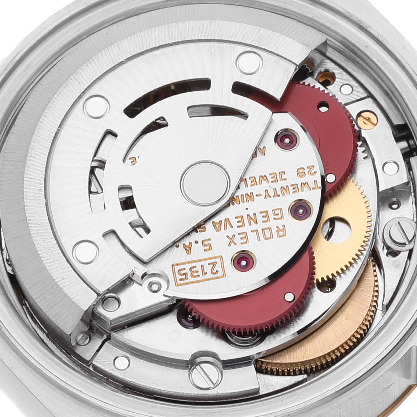 The image shows an up-close view of the Rolex Datejust 69173 Women's Steel and Gold (two tone) Champagne Dial 69173 Women's Steel and Gold (two tone) Champagne Dial movement with visible gears and engraved details.