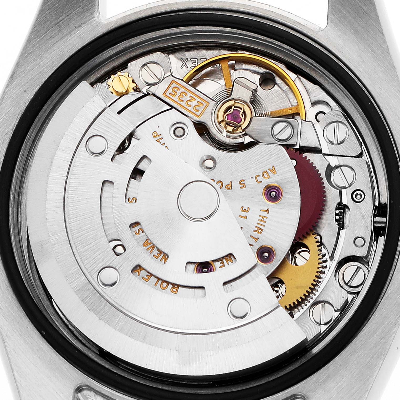 The image shows the movement mechanism of a Rolex Datejust 179173 Women's Steel and Gold (two tone) Black Dial watch viewed from the back, highlighting gears and components.