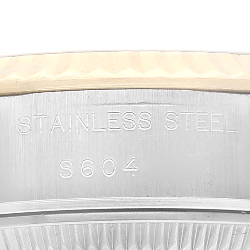 This close-up shows the stainless steel side and bezel portion of a Rolex Datejust 69173 Women's Steel and Gold (two tone) Champagne Dial 69173 Women's Steel and Gold (two tone) Champagne Dial watch.