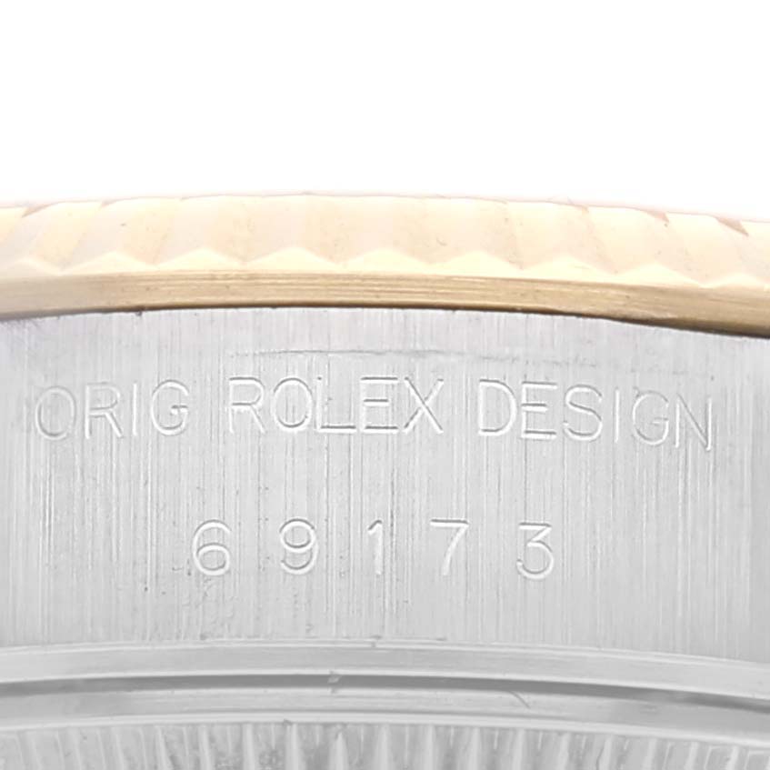This image shows a close-up view of the model number and the "Orig Rolex Design" engraving on a Rolex Datejust 69173 Women's Steel and Gold (two tone) Champagne Dial 69173 Women's Steel and Gold (two tone) Champagne Dial watch case.