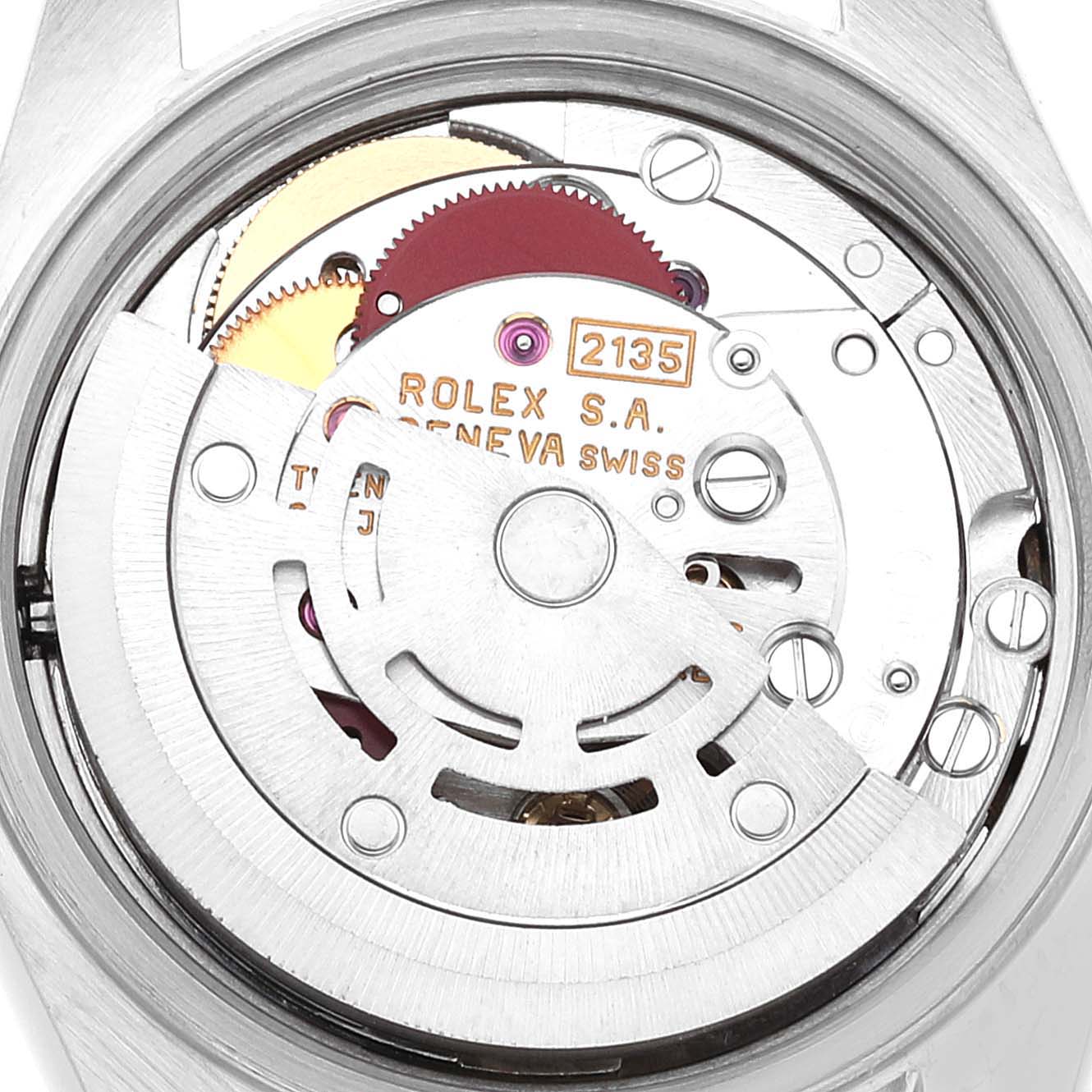 This is a close-up view of the movement mechanism of a Rolex Datejust 69173 Women
s Steel and Gold (two tone) Grey Dial 69173 Women
s Steel and Gold (two tone) Grey Dial watch, showing intricate internal components and inscriptions.