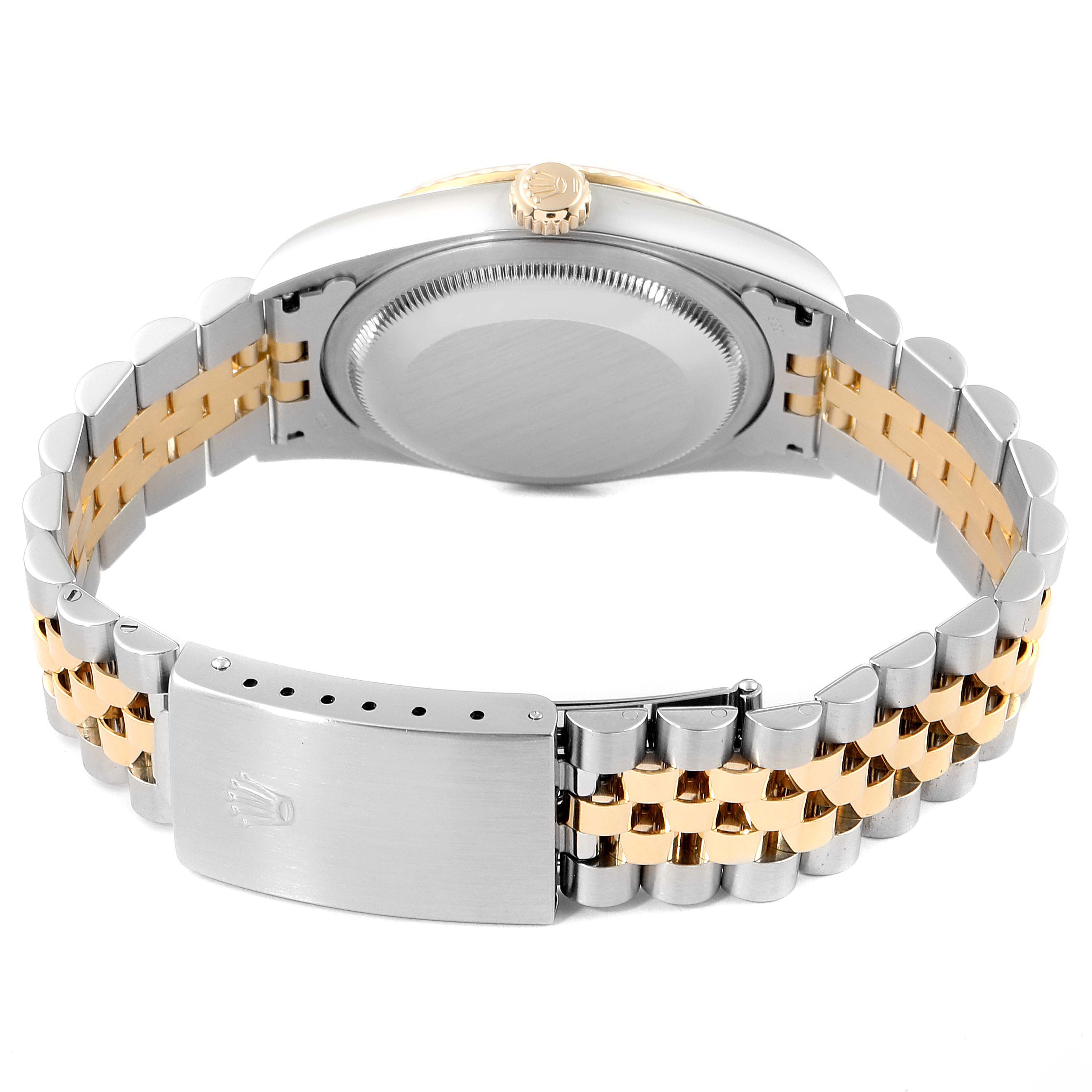 This is a rear view of the Rolex Datejust 16233 Men's Steel and Gold (two tone) Silver Dial 16233 Men's Steel and Gold (two tone) Silver Dial showing the closed clasp, back case, and part of the bracelet.