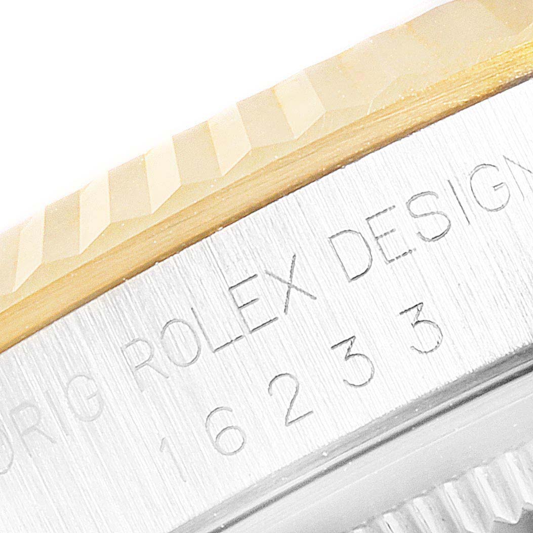 The image shows a close-up of the bezel and side of the stainless steel case of a Rolex Datejust 16233 Men's Steel and Gold (two tone) Silver Dial 16233 Men's Steel and Gold (two tone) Silver Dial watch, displaying its model number.