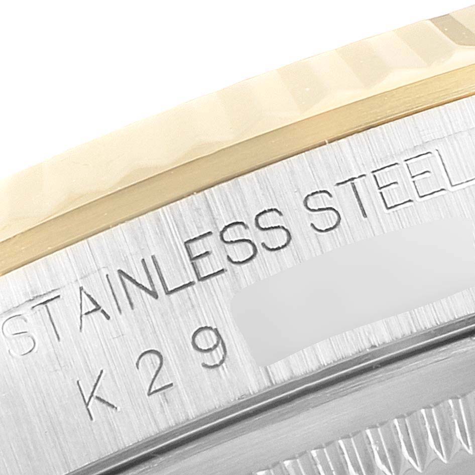 The image shows a close-up of the side of a Rolex Datejust 16233 Men's Steel and Gold (two tone) Silver Dial 16233 Men's Steel and Gold (two tone) Silver Dial watch, highlighting the "STAINLESS STEEL" inscription and part of the bezel.