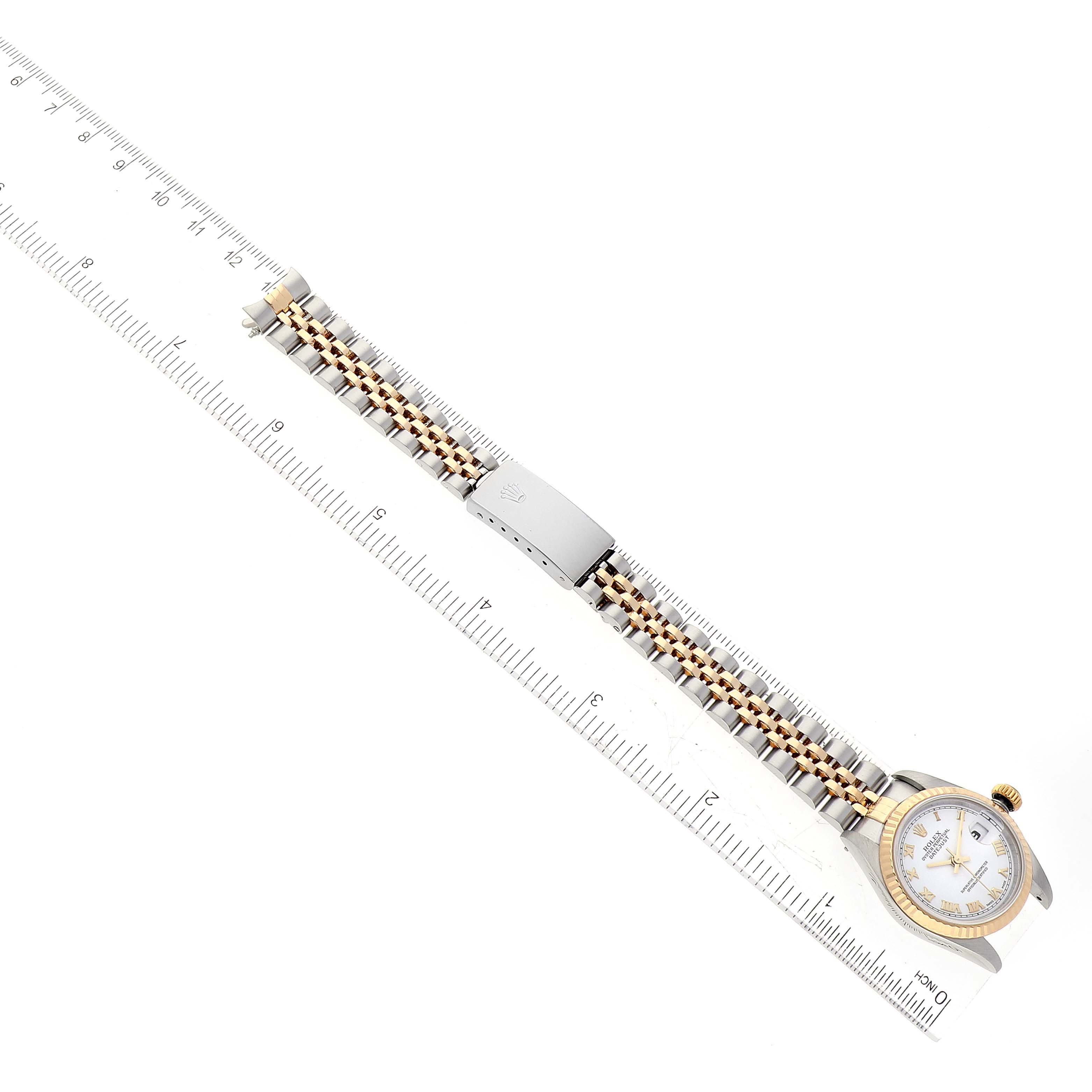 The Rolex Datejust 79173 Women's Steel and Gold (two tone) White Dial 79173 Women's Steel and Gold (two tone) White Dial watch is shown from an overhead angle, displaying the face, bezel, crown, and bracelet.