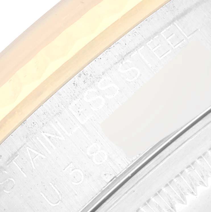 The image shows a close-up of the case back edge of a Rolex Datejust 16233 Men's Steel and Gold (two tone) White Dial 16233 Men's Steel and Gold (two tone) White Dial watch, highlighting the stainless steel engraving.