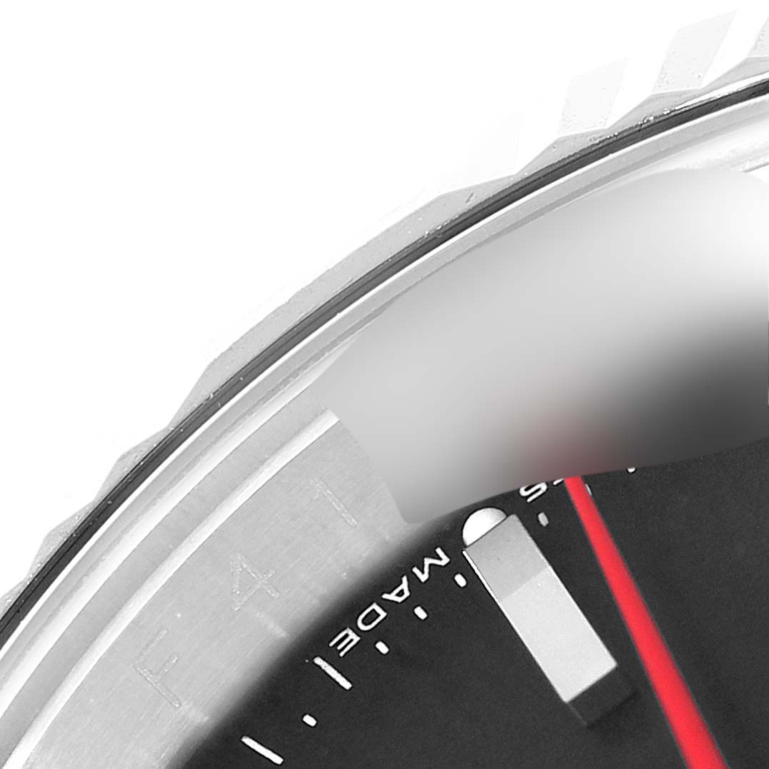 The image shows a close-up of the bezel edge, part of the dial, and a marker on the Rolex Turn-o-Graph 116264 Men
s Stainless Steel Black Dial 116264 Men
s Stainless Steel Black Dial watch.