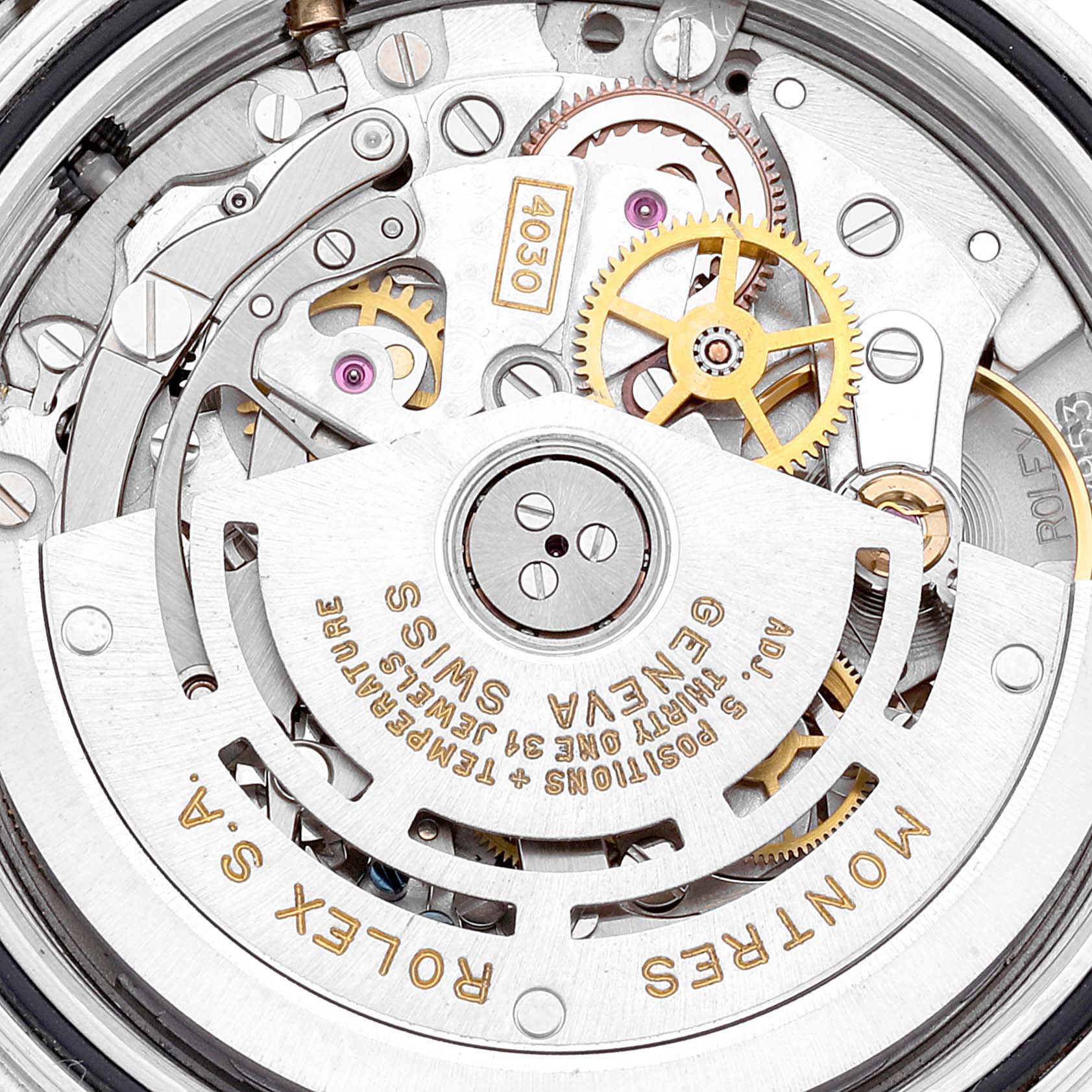 This image shows a close-up of the intricate movement mechanism of a Rolex Daytona 16523 Men's Steel and Gold (two tone) Champagne Dial 16523 Men's Steel and Gold (two tone) Champagne Dial watch.