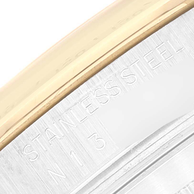 The image shows a close-up of the stainless steel and gold bezel of a Rolex Daytona 16523 Men's Steel and Gold (two tone) Champagne Dial 16523 Men's Steel and Gold (two tone) Champagne Dial watch.