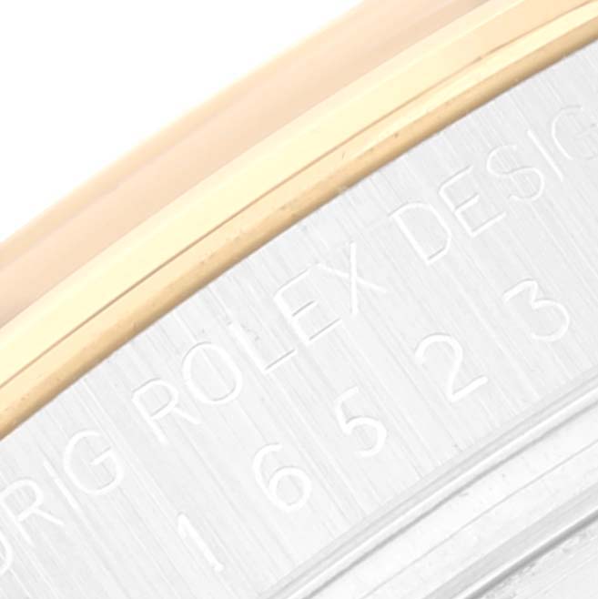 The image shows a close-up of the engraving on the bezel and case, focusing on the model details of the Rolex Daytona 16523 Men's Steel and Gold (two tone) Champagne Dial 16523 Men's Steel and Gold (two tone) Champagne Dial watch.