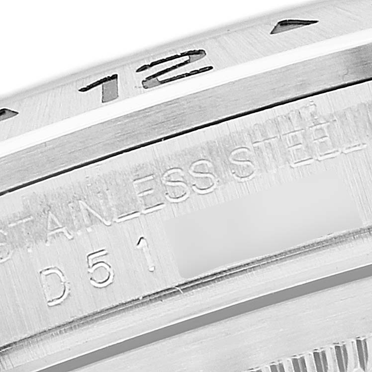 The image shows a close-up of the Rolex Explorer 16570 Men
s Stainless Steel White Dial 16570 Men
s Stainless Steel White Dial
s bezel and part of the inscription on the watch case.