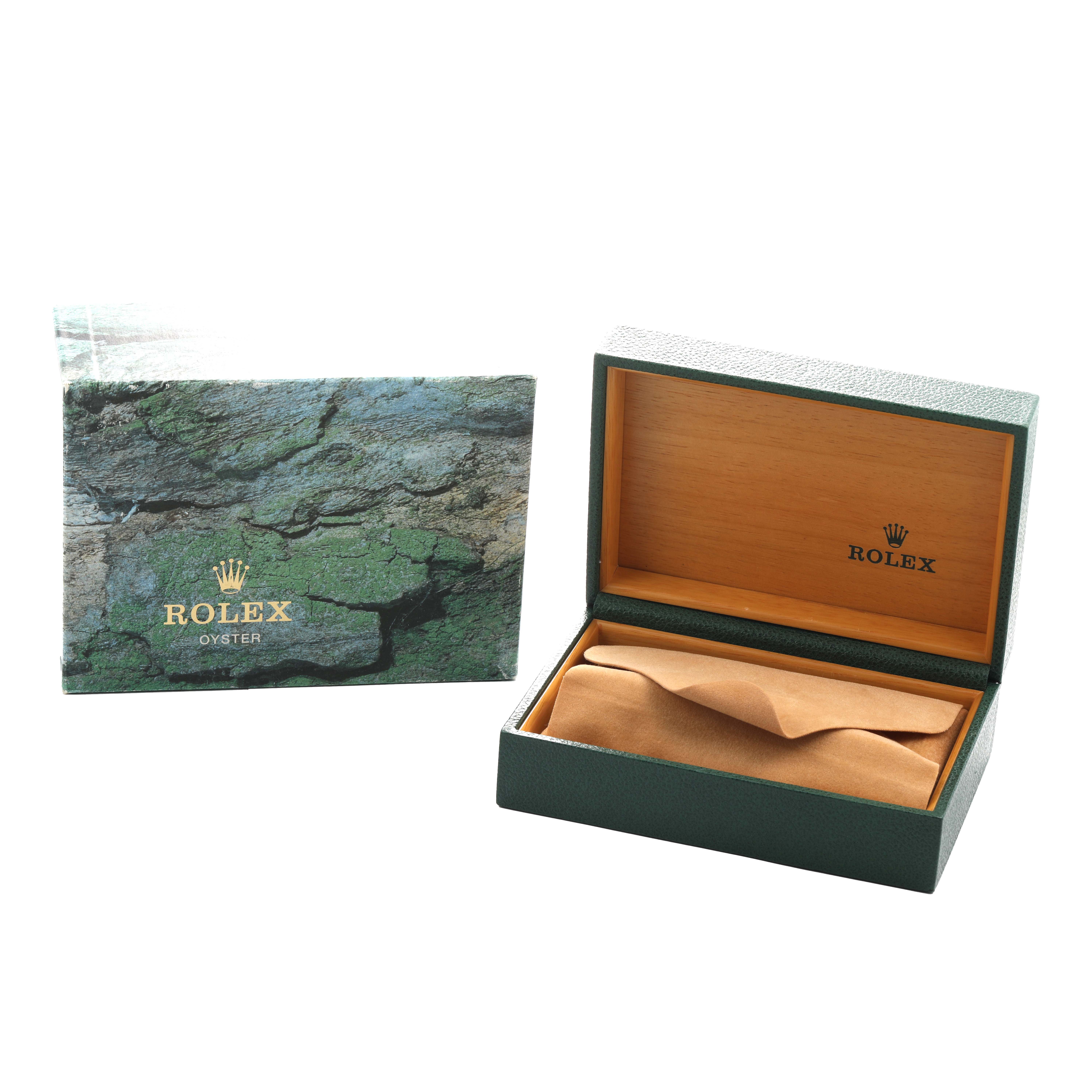 The image shows a Rolex Explorer 16570 Men's Stainless Steel Black Dial box set at an angle, featuring an open green watch box and its exterior packaging.