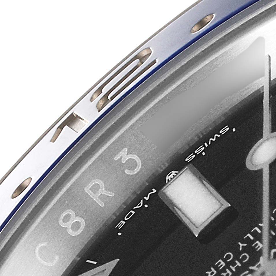The image shows a close-up of the bezel and part of the dial of a Rolex GMT-Master 126710 Men
s Stainless Steel Black Dial 126710 Men
s Stainless Steel Black Dial watch, highlighting the number "15" and various markings.