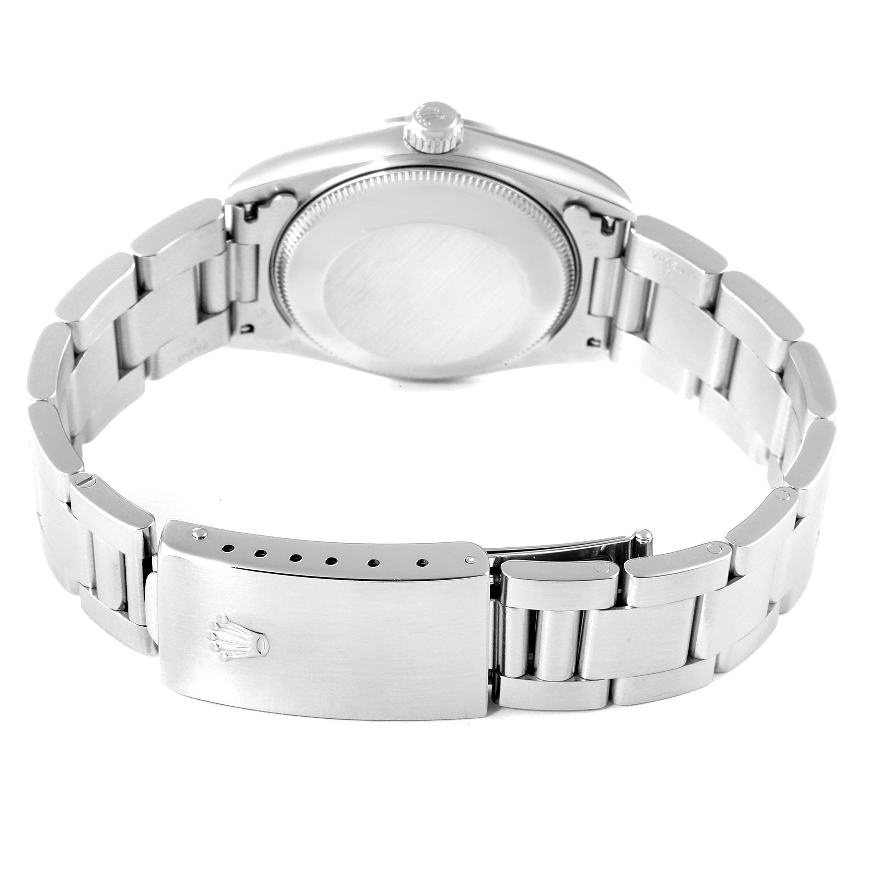 This is the back view showing the caseback and fold-over clasp of a Mid-Size Rolex watch.