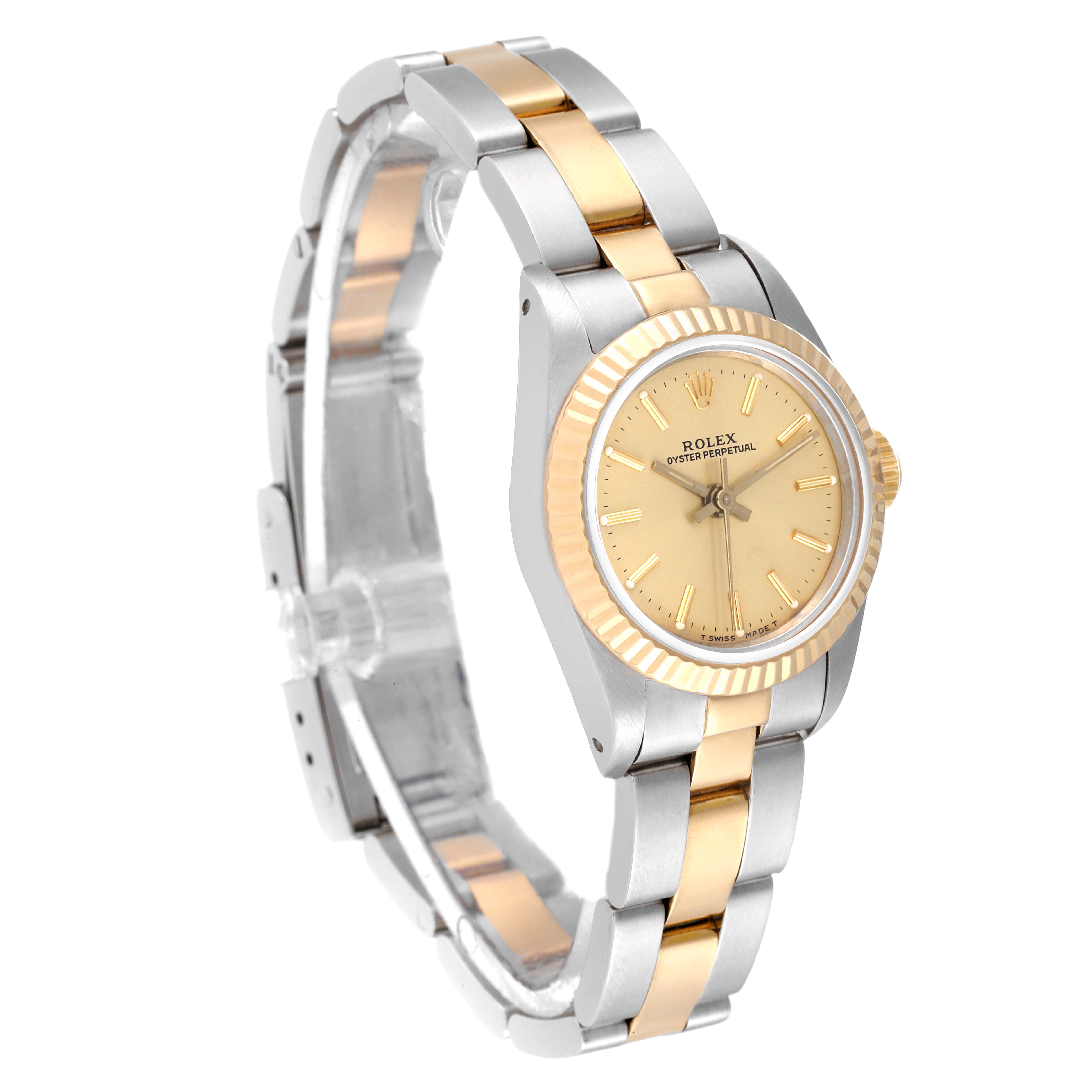 This image shows a Rolex Oyster Perpetual 67193 Women's Steel and Gold (two tone) Champagne Dial 67193 Women's Steel and Gold (two tone) Champagne Dial watch at a three-quarter angle, highlighting its two-tone metal bracelet and face.