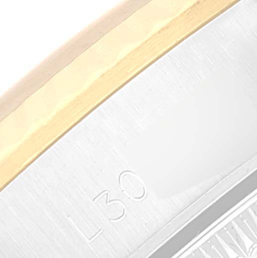 The image shows a close-up of the bezel and case side of a Rolex Oyster Perpetual 67193 Women's Steel and Gold (two tone) Champagne Dial 67193 Women's Steel and Gold (two tone) Champagne Dial watch, focusing on engraving details.