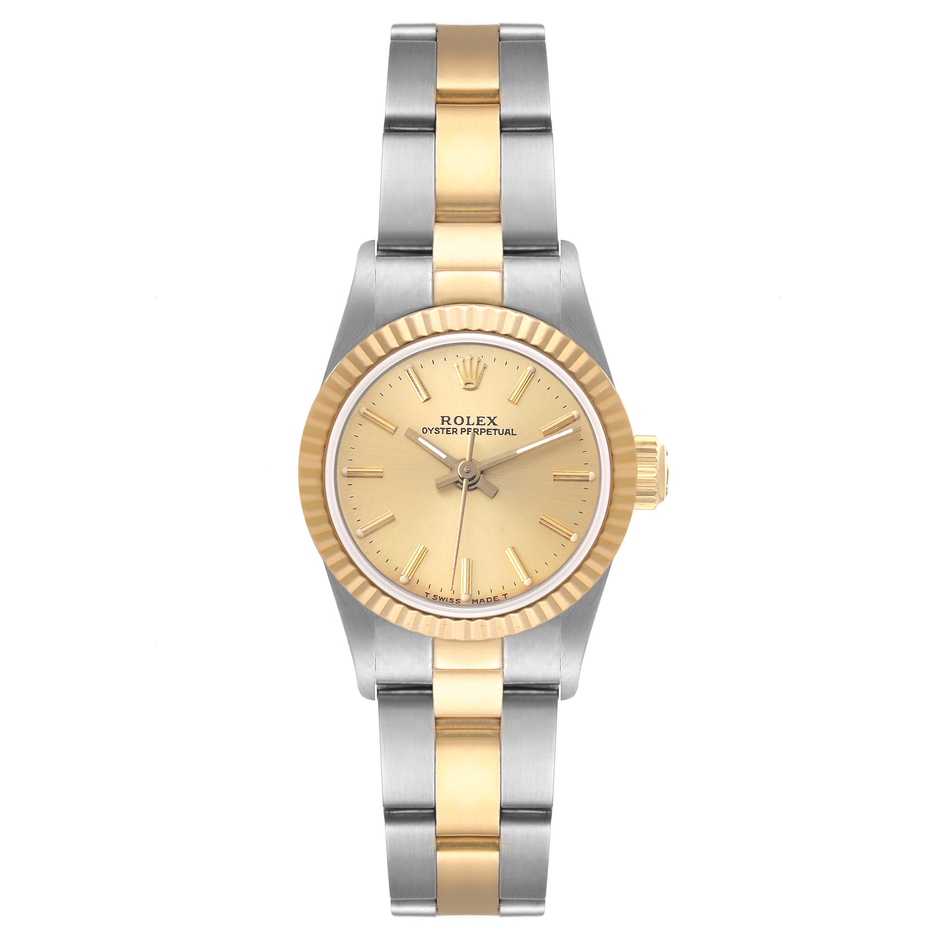 This Rolex Oyster Perpetual 67193 Women's Steel and Gold (two tone) Champagne Dial 67193 Women's Steel and Gold (two tone) Champagne Dial watch is shown from a top-down angle, displaying the dial, bezel, and bracelet.
