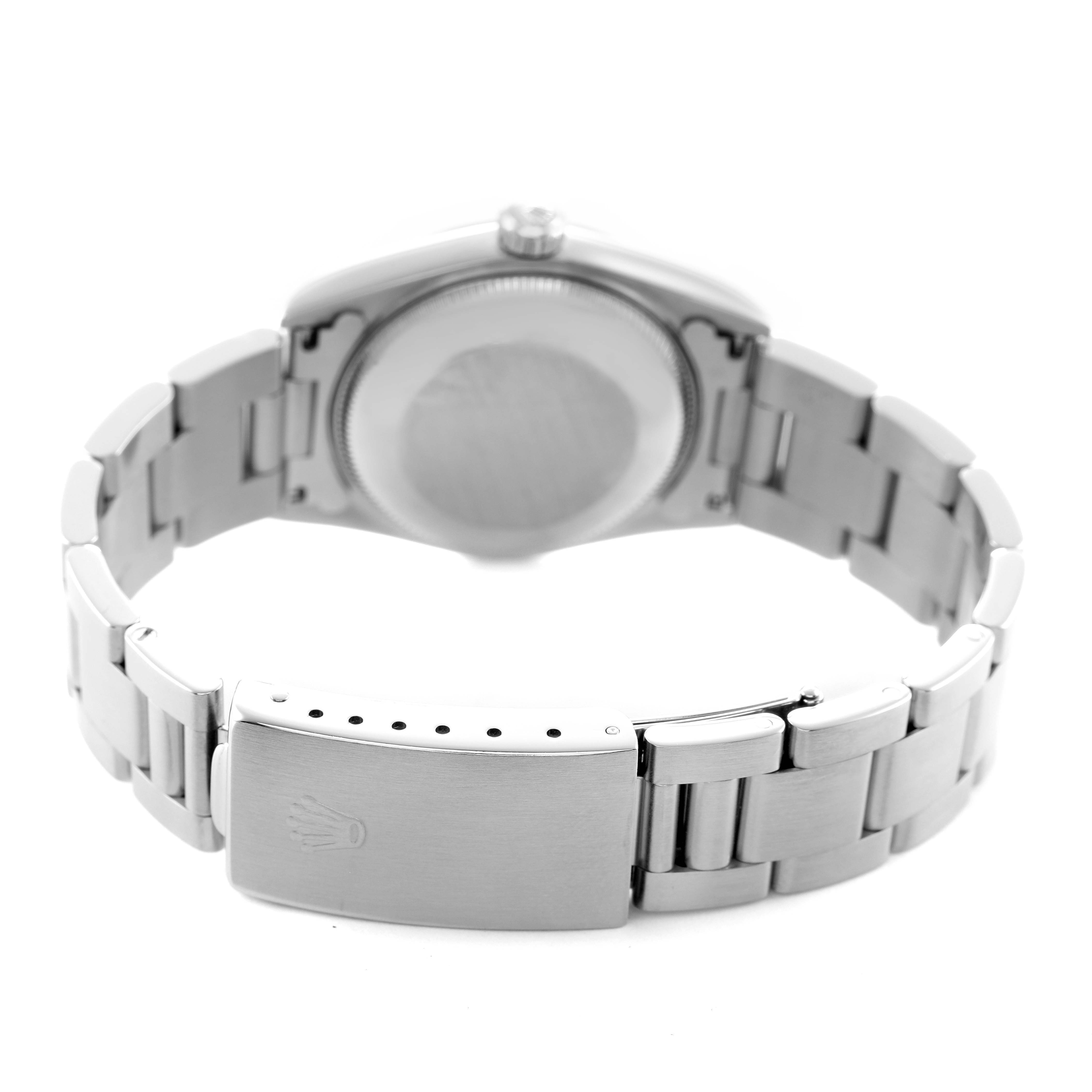 The image shows the back view of a Rolex Mid-Size 67480 Women's Stainless Steel Pink Dial watch, highlighting the clasp and bracelet.