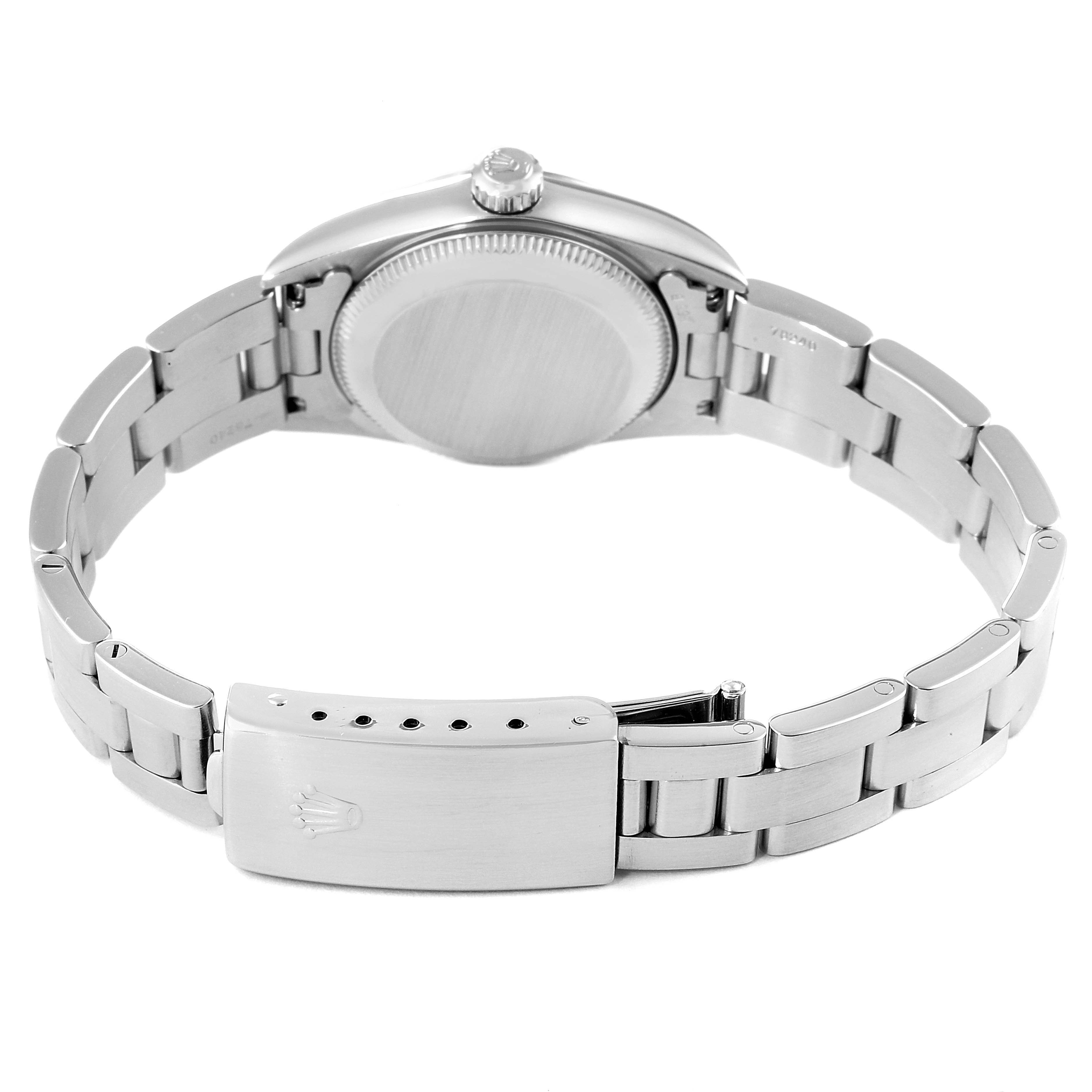 This image shows the back case and stainless steel bracelet of a Rolex Oyster Perpetual 76080 Women
s Stainless Steel Pink Dial 76080 Women
s Stainless Steel Pink Dial watch.