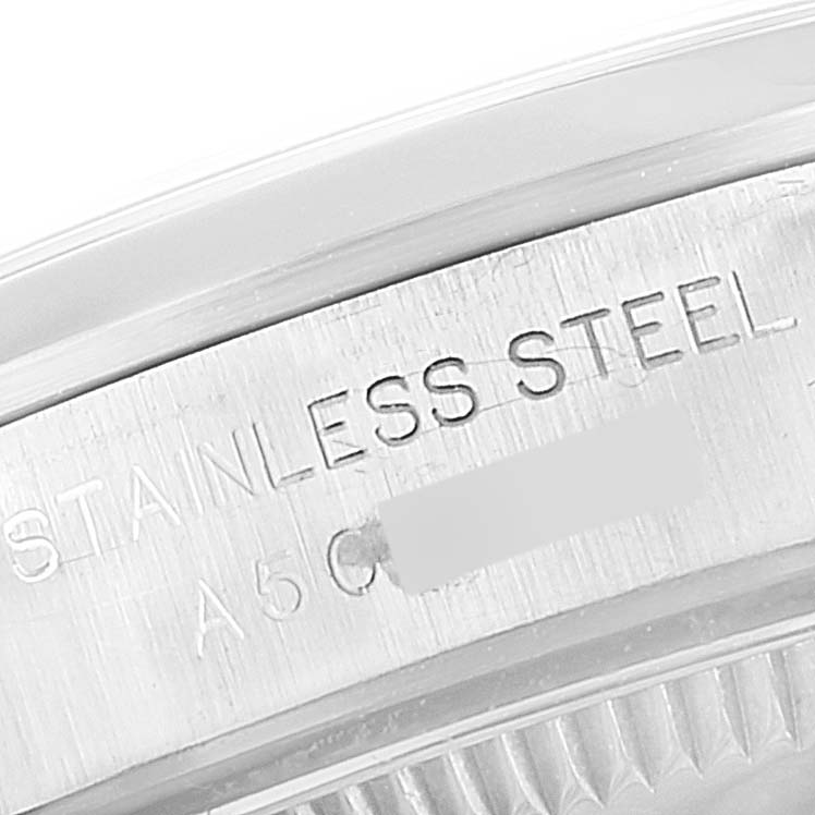 This image shows a close-up of the side engraving on a Rolex Oyster Perpetual 76080 Women
s Stainless Steel Pink Dial 76080 Women
s Stainless Steel Pink Dial watch, highlighting the "STAINLESS STEEL" text.
