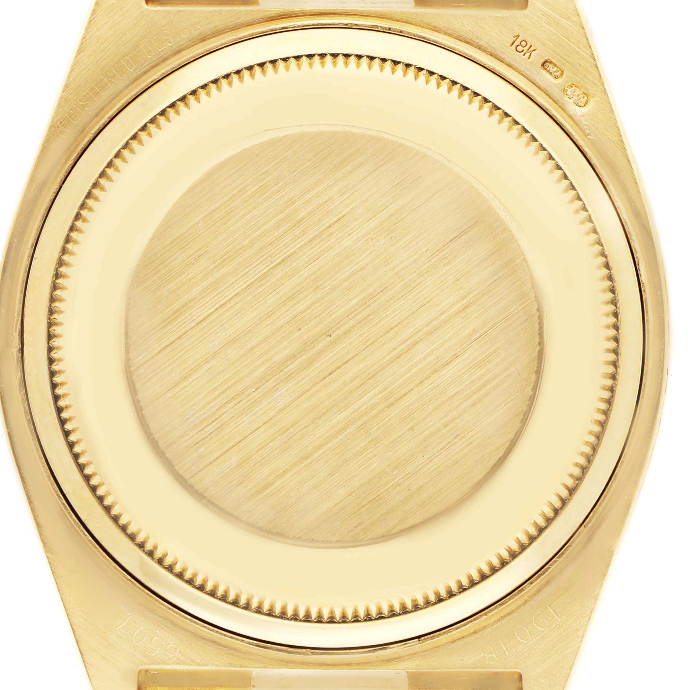 The image shows the back case of a Rolex Oysterquartz 19018 Men's Yellow Gold Champagne Dial watch, viewed from the rear angle.