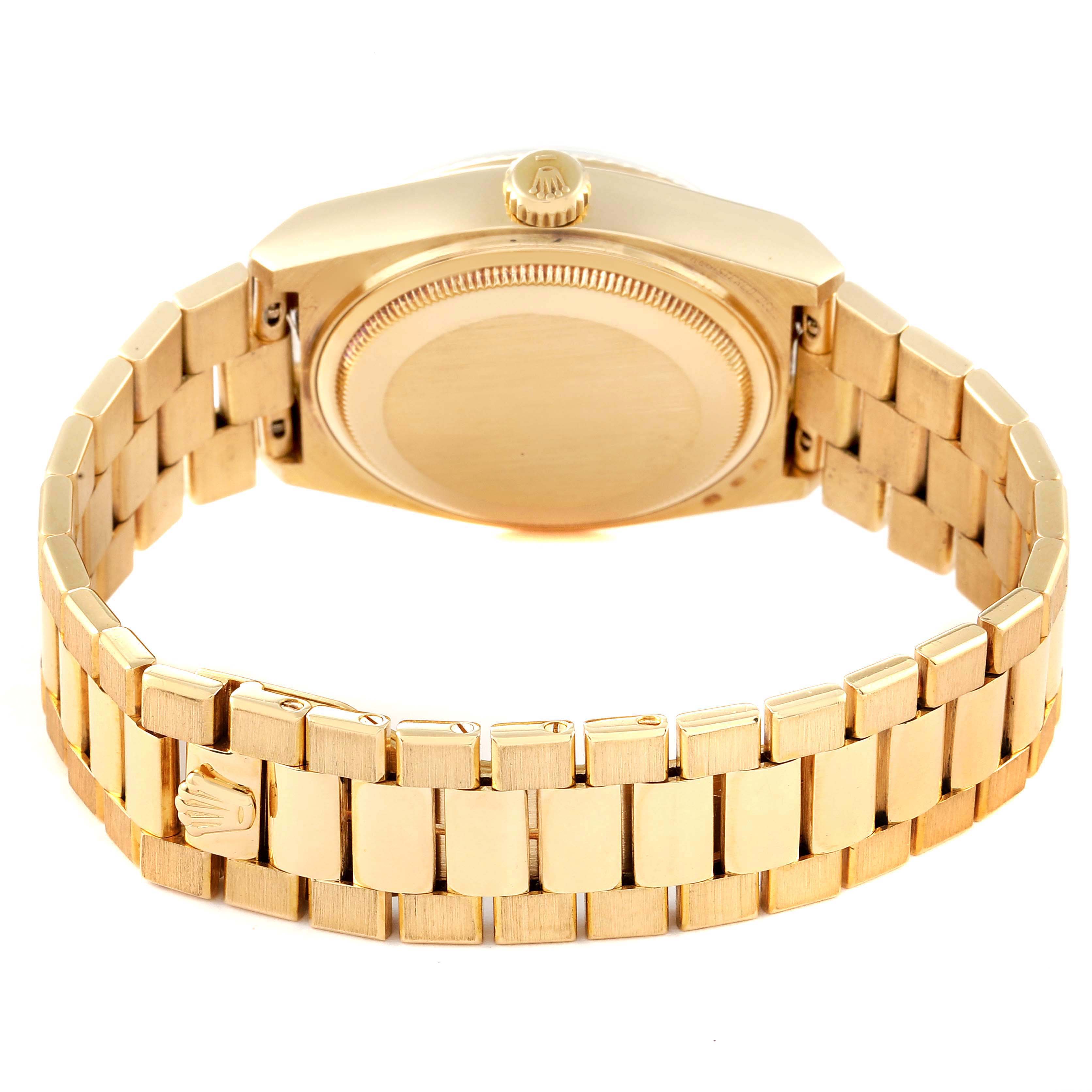 The image shows the back of a Rolex Oysterquartz 19018 Men's Yellow Gold Black Dial 19018 Men's Yellow Gold Black Dial watch, highlighting its bracelet and case back.