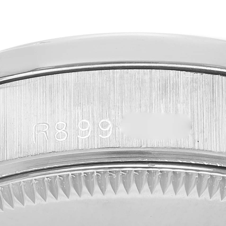 The image shows a close-up of the case side and part of the bezel of a Rolex President 68289 Women's White Gold Silver Dial 68289 Women's White Gold Silver Dial model watch, displaying part of the serial number.