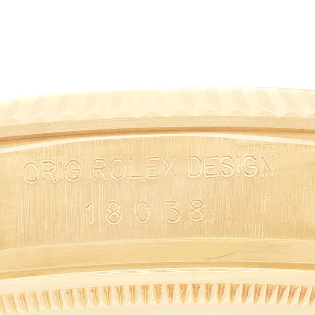 This close-up image shows the engraved serial number and model details on the case side of a Rolex President 18038 Men
s Yellow Gold Champagne Dial 18038 Men
s Yellow Gold Champagne Dial model.