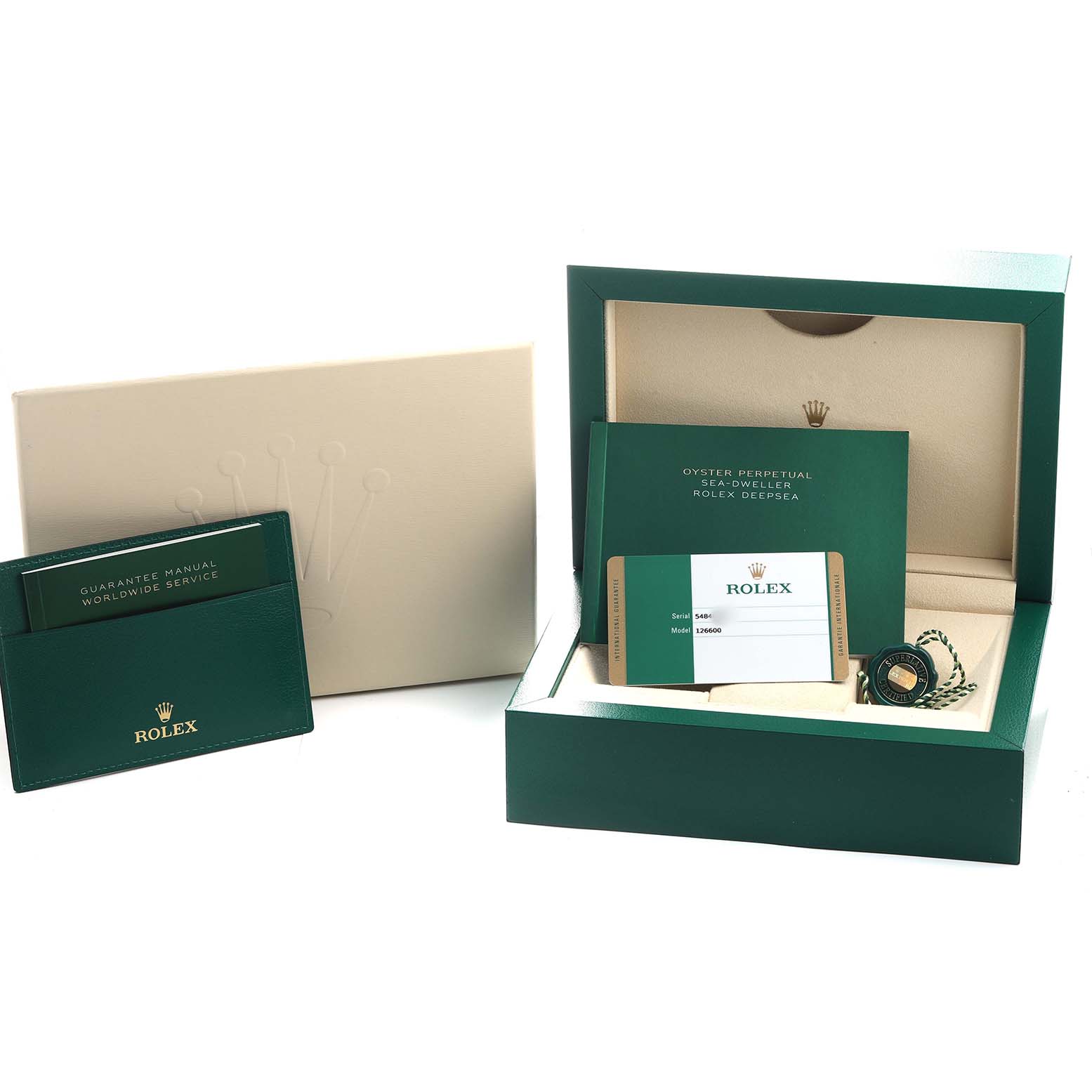 The image shows the packaging and accessories for a Rolex Sea-Dweller 126600 Men's Stainless Steel Black Dial, including an open box, manuals, and certification cards.