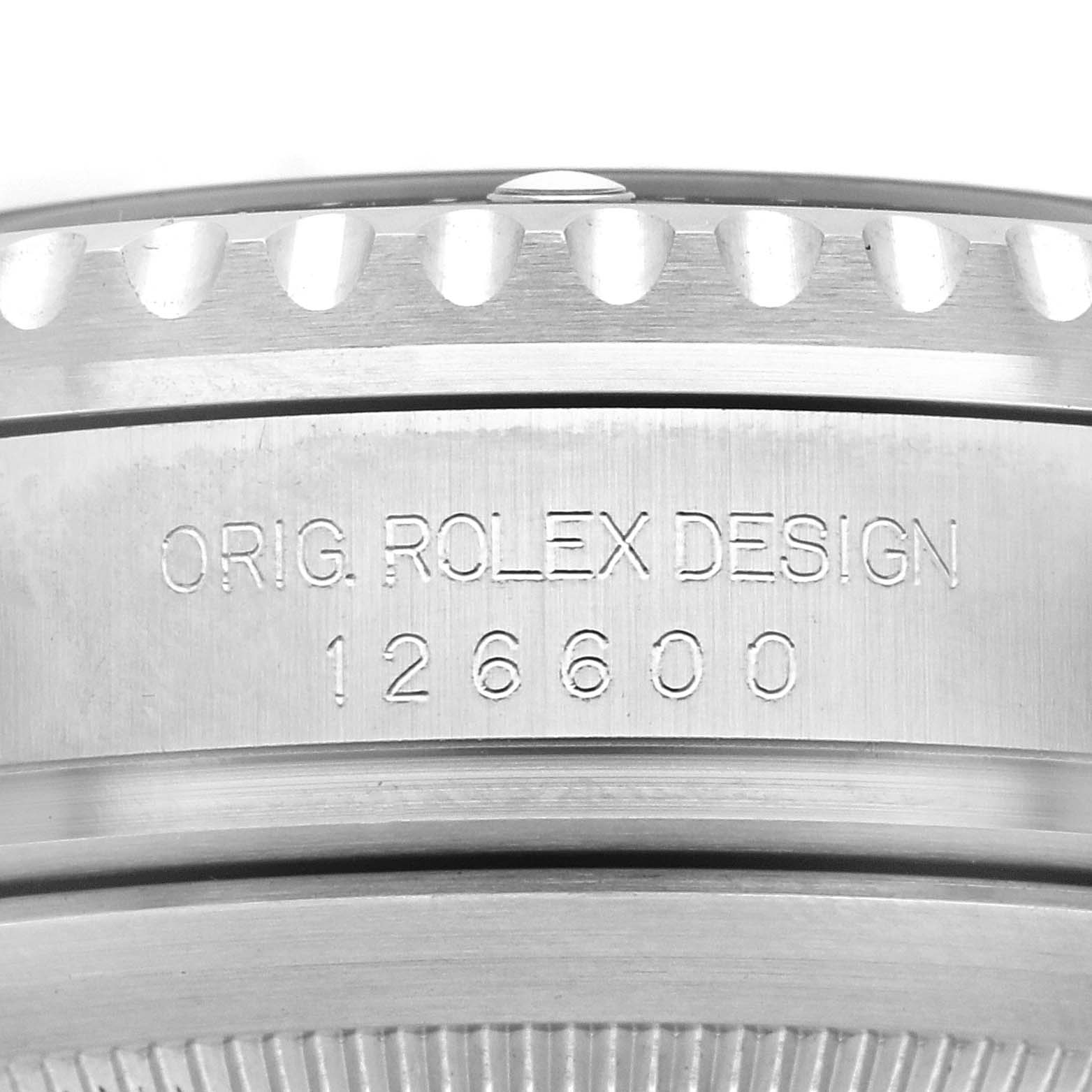 The image shows the side of the Rolex Sea-Dweller 126600 Men's Stainless Steel Black Dial's case, displaying the model number 126600 and design engraving.