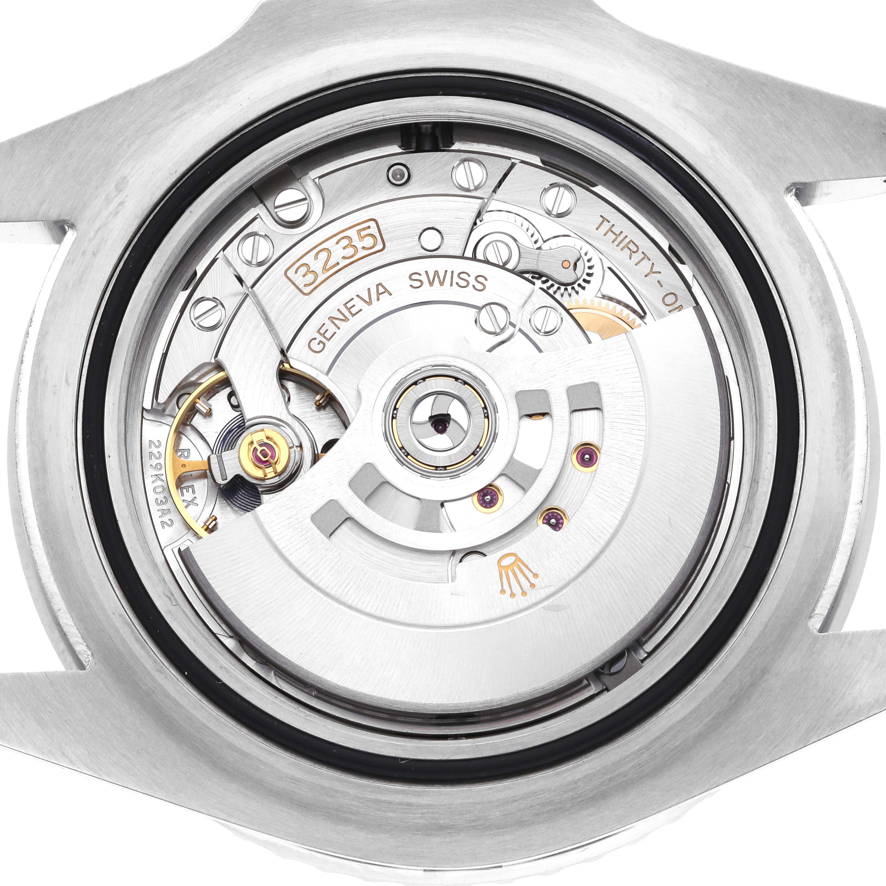 The image shows the movement's back view of a Rolex Sea-Dweller 126600 Men's Stainless Steel Black Dial, highlighting the rotor and intricate mechanical components.